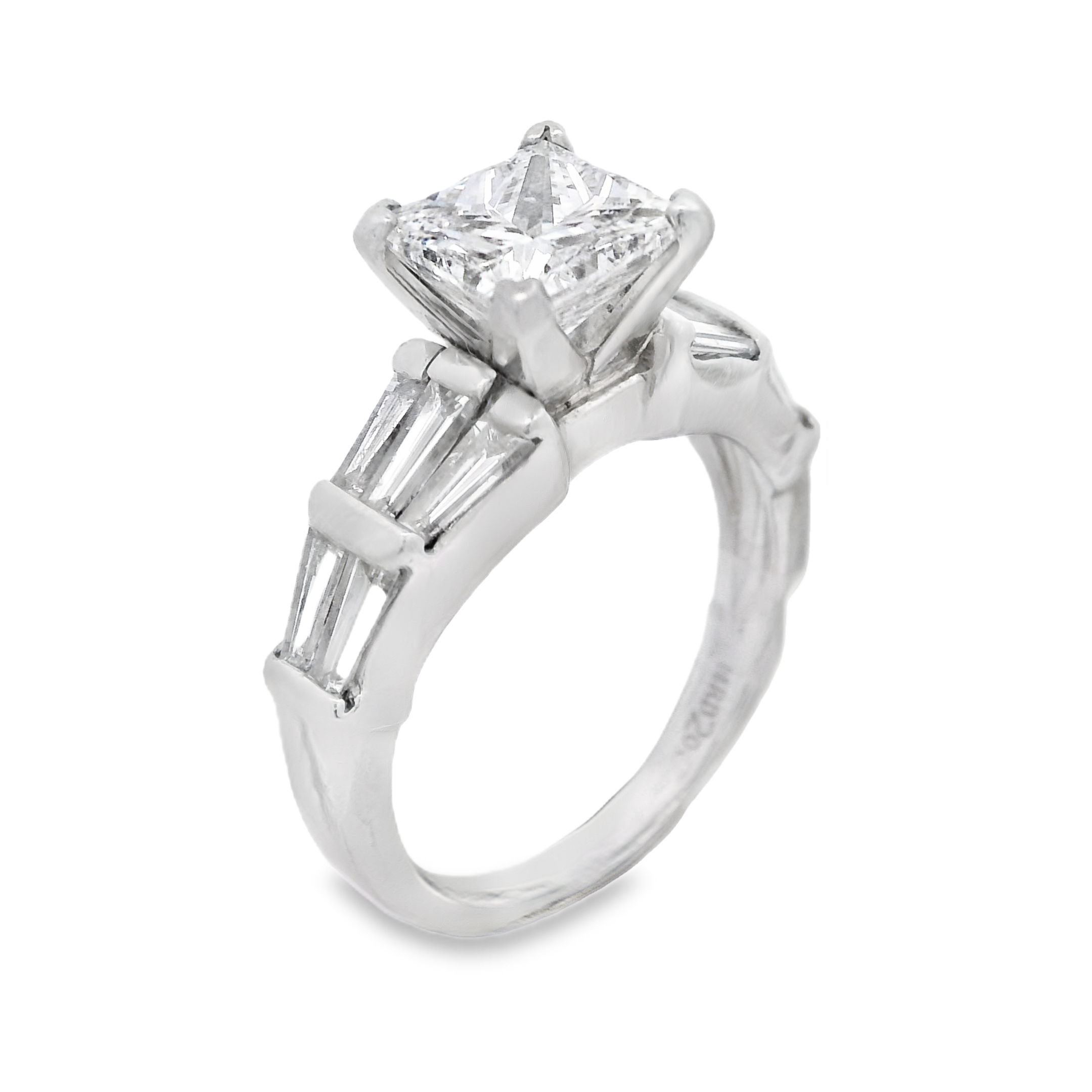 This elegant Platinum engagement ring showcases the timeless beauty of tapered baguette diamonds, bar-set along the band for a sleek, sophisticated look. The tapered design draws attention to the center diamond, creating a refined and balanced silhouette. (Center diamond sold separately)-Platinum-Baguette diamonds, 1.20cts-Size 7, Contact for sizing optionsItem# 140-00228 Princess Cut Engagement Ring