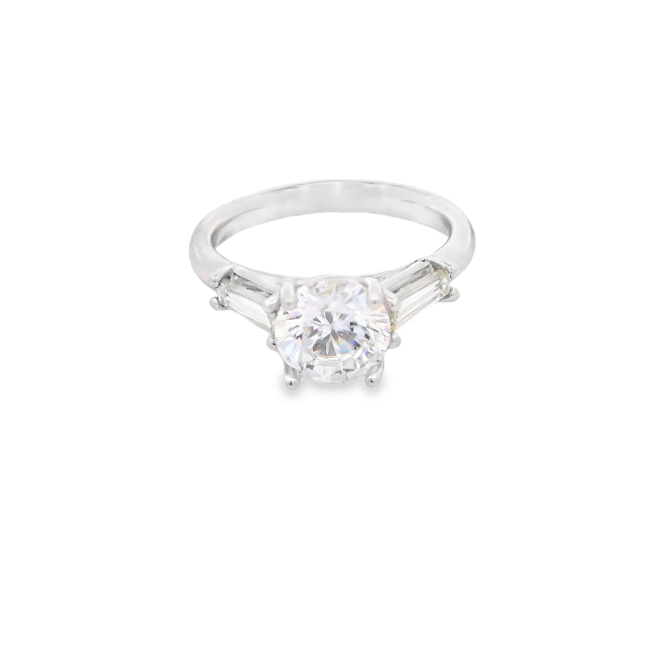 This three-stone semi-mount offers a refined, elegant setting for your center stone. Two sleek tapered baguette diamonds frame the center, adding symmetry and a touch of modern sophistication. (Center stone not included)-18k White gold-Baguette diamonds, 0.63cts-Size 6.5, Contact for sizing optionsItem# 140-00229 Three-Stone Semi-Mount