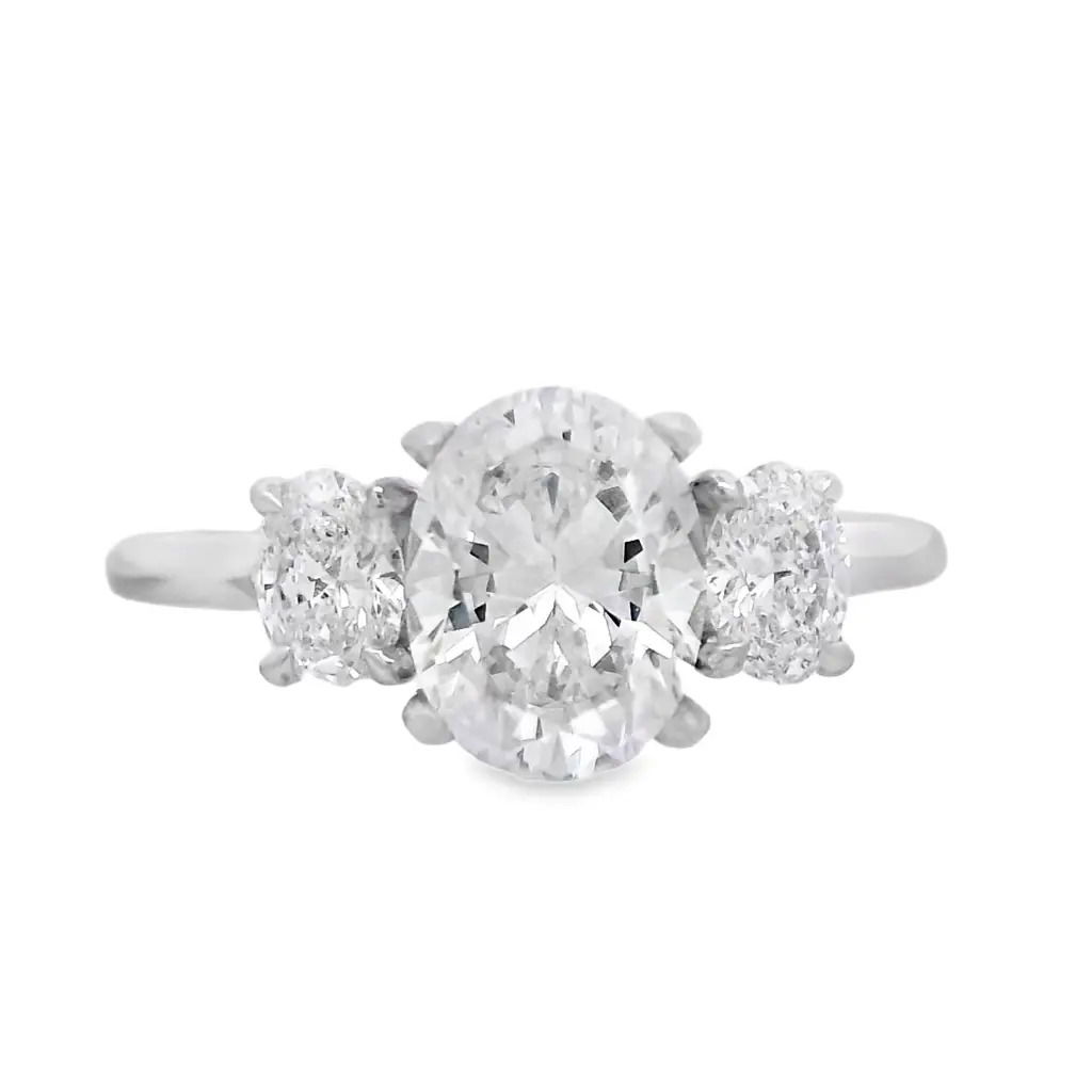 This three-stone semi-mount is a timeless symbol of past, present, and future. Designed to hold an oval center stone, it's flanked by two perfectly matched side stones for added brilliance and balance. (Center stone not included)-14k White gold-Oval diamonds, 0.50cts-Size 7, Contact for sizing optionsItem# 140-00230 Oval Three-Stone Semi-Mount