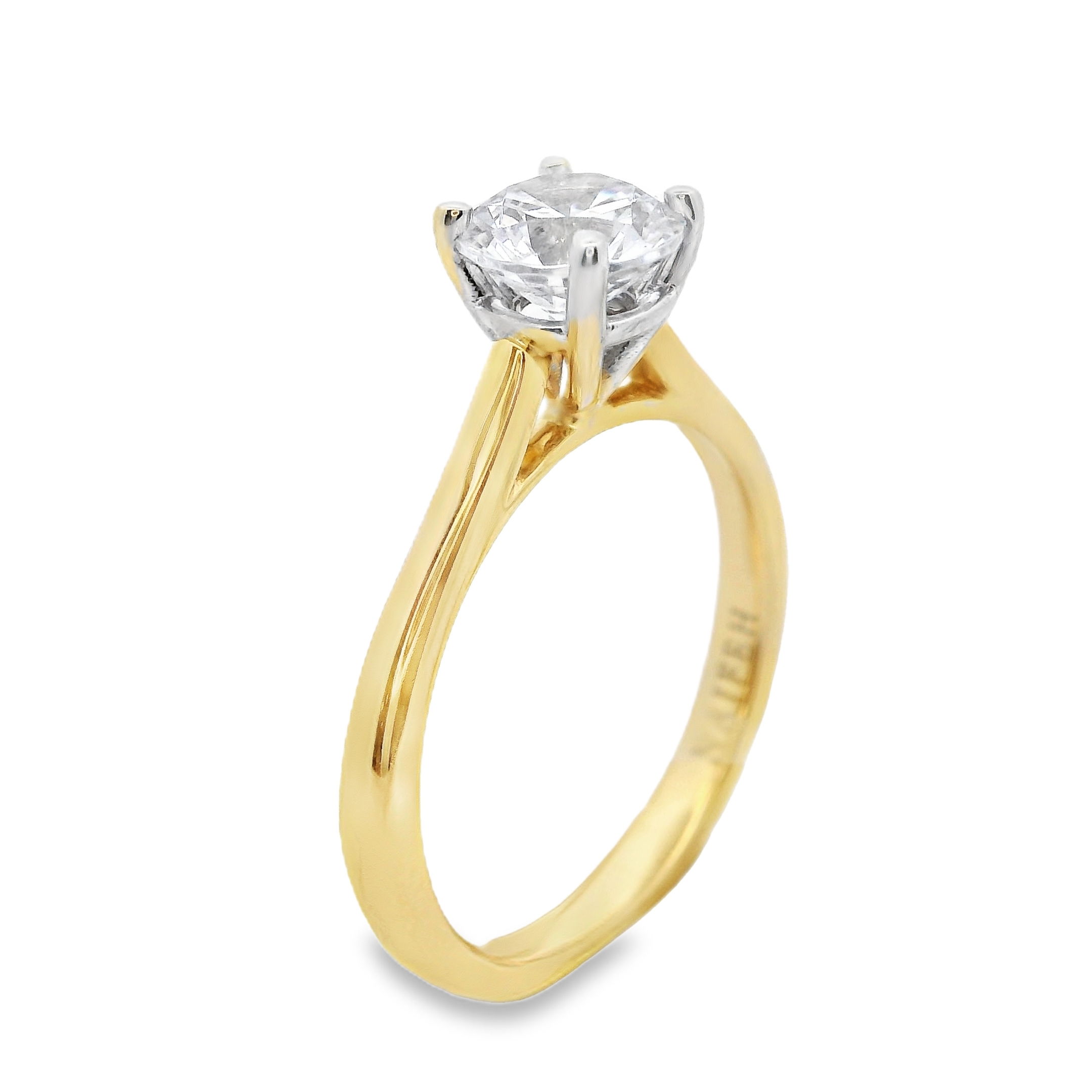 The timeless Naifeh Solitaire semi-mount in 18k Yellow gold features an elegant cathedral setting and is all hand-crafted in house. Its sophisticated design is customizable to fit any shape and size stone, offering endless possibilities to create the perfect ring to match your unique style. Make this exquisite piece truly yours. (Center stone not included)-18k Yellow gold-Size 6.5, Contact for sizing optionsItem# 140-00238 Naifeh Solitaire