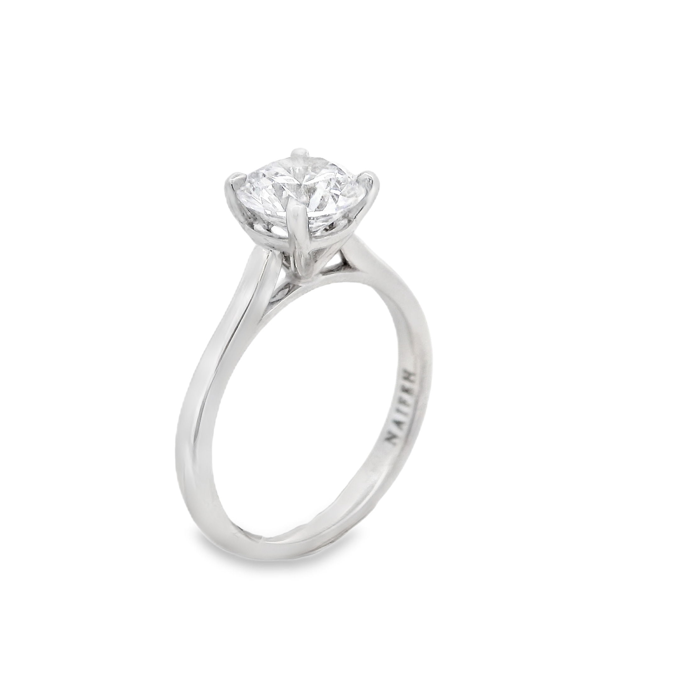 The timeless Naifeh Solitaire semi-mount in 18k White gold features an elegant cathedral setting and is all hand-crafted in house. Its sophisticated design is customizable to fit any shape and size stone, offering endless possibilities to create the perfect ring to match your unique style. Make this exquisite piece truly yours. (Center stone not included)-18k White gold-Size 6.5, Contact for sizing optionsItem# 140-00243 Naifeh Solitaire