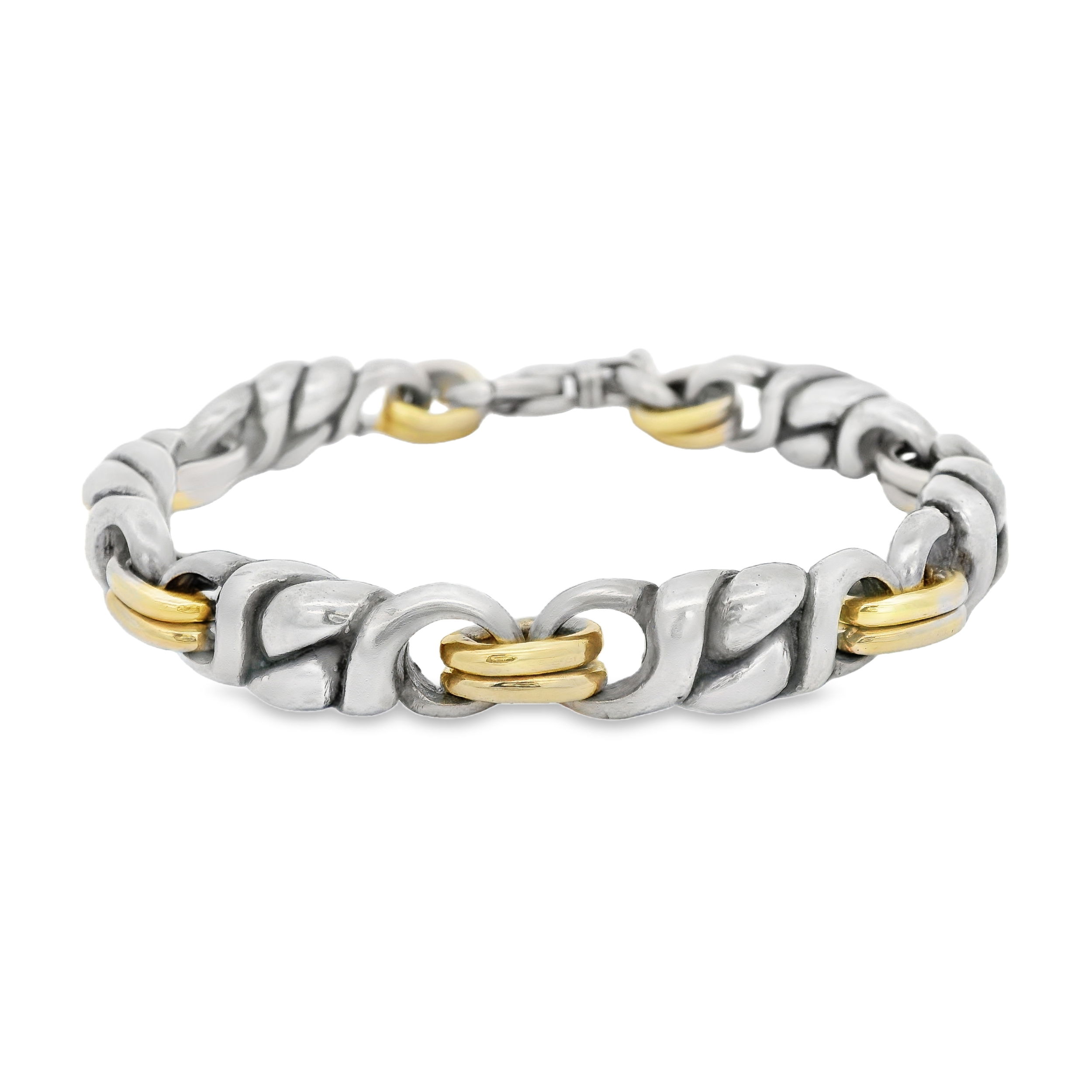 This exceptional men’s bracelet combines the cool elegance of sterling silver with the warm richness of 18k yellow gold. The expertly crafted design showcases a harmonious blend of metals, creating a sophisticated and enduring statement piece.-Sterling silver-18k Yellow gold-10mm width-8.5" in lengthItem# 800-00264 Silver and Gold Link Bracelet