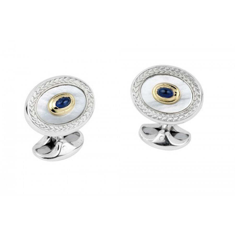 These Deakin & Francis cufflinks showcase lustrous mother of pearl inlays complemented by rich sapphire accents, offering a refined and elegant statement. Expertly crafted in sterling silver, they provide a timeless accessory for the discerning gentleman.-Cabochon sapphires-Mother of pearl-Sterling silver-18k Yellow gold-18k Rose gold-Item# 001-800-00373 Mother of Pearl and Sapphire Cufflinks