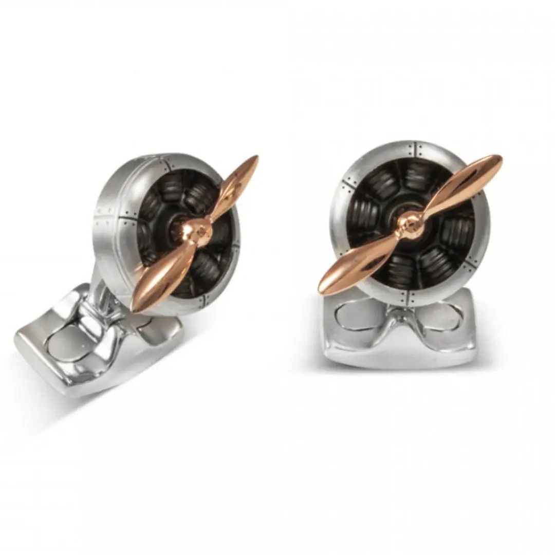 Deakin & Francis men’s cufflinks are expertly crafted from sterling silver and aircraft-grade aluminum, featuring working propellers plated in 18k rose gold. Designed to resemble the iconic Sopwith Camel airplane propeller, they make a distinctive and stylish gift for the discerning aviation enthusiast.-Sterling silver-Aircraft grade aluminum-Rose gold plating-Item# 001-800-00410 Airplane Propeller Cufflinks