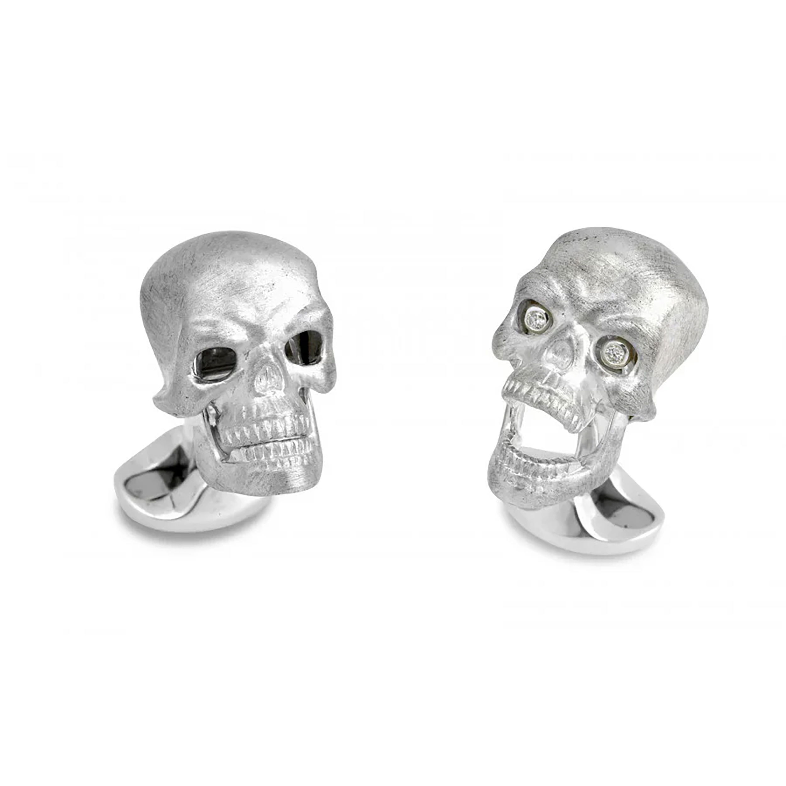 This Deakin & Francis cufflink and stud set features finely crafted sterling silver skulls, each set with gleaming diamond eyes for a distinctive, elegant edge. A bold fusion of luxury and character, it’s the perfect finishing touch for formal attire.-Sterling silver-Diamonds, 0.10ctsItem# 001-800-00431 Skulls Cufflink and Stud Set