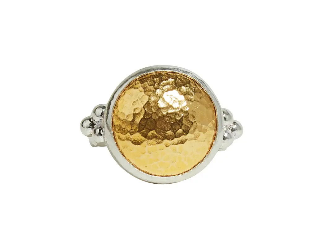 This gold dome ring features a sterling silver base with a bold 24k yellow gold center. Its striking two-tone design makes it a standout accessory for any look.-Sterling silver-24k Yellow gold-Size 6.5Item# 001-804-00754 Gold Dome Cocktail Ring