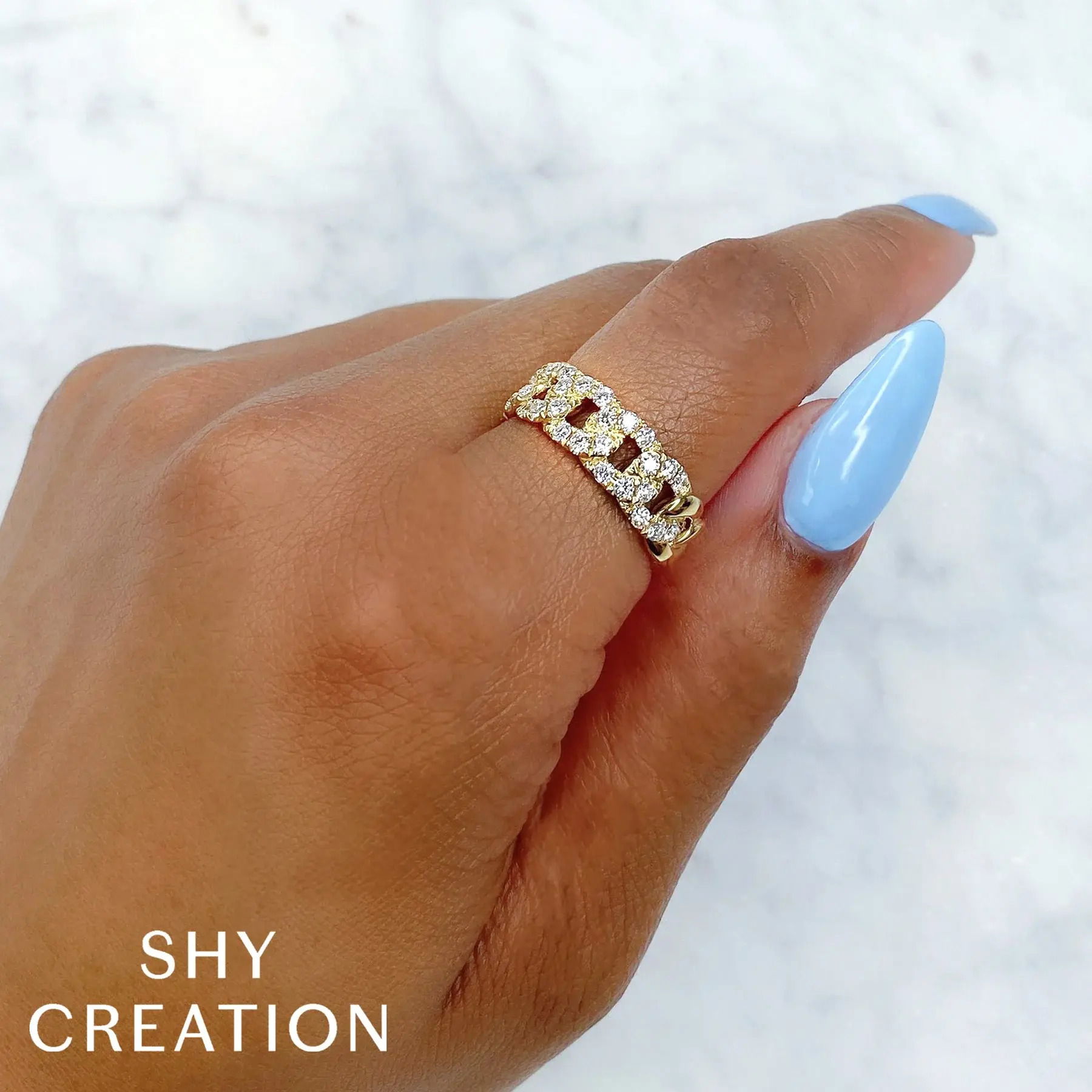 The perfect balance of elegance and practicality, this piece is designed to suit any style with ease. All Shy Creation diamonds are natural and hand-selected. All stones are unique and hand set. As a result, you can expect slight variations in the shade, hue, tint of the color stones and stone count.-14k Yellow gold-Round diamonds, 0.76cts-Dimensions, 0.40"W-Size 7Item# 804-00763 Diamond Link Ring