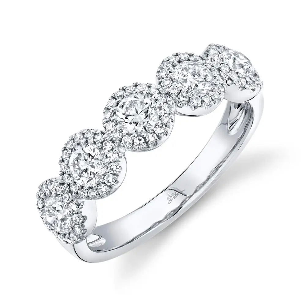 Classy and timeless, this piece offers fashion-forward elegance that will enhance your collection for years to come. All Shy Creation diamonds are natural and hand-selected. All stones are unique and hand set. As a result, you can expect slight variations in the shade, hue, tint of the color stones and stone count.-14k White gold-Round diamonds, 1.25cts-Size 7Item# 804-00837 Round Diamond Band