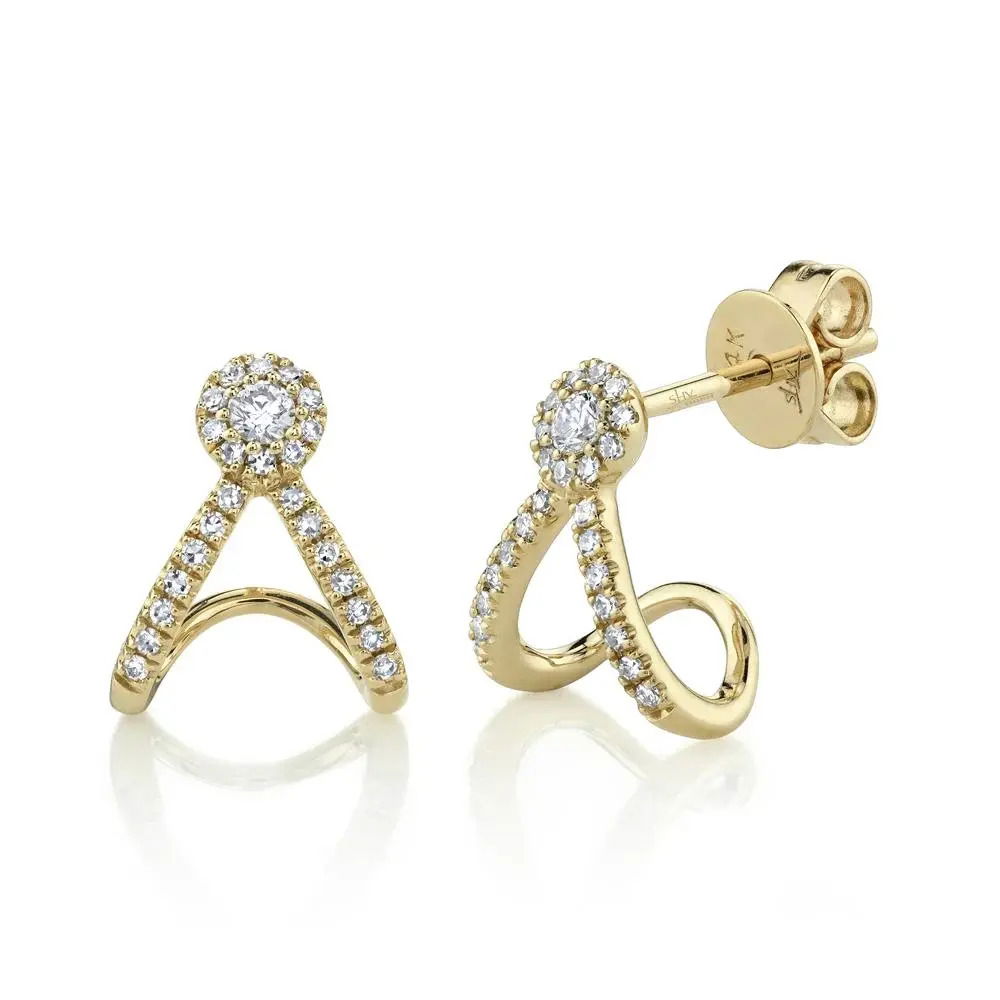 With its bold design, this piece commands attention and invites conversation at any event. All Shy Creation diamonds are natural and hand-selected. All stones are unique and hand set. As a result, you can expect slight variations in the shade, hue, tint of the color stones and stone count.-14k Yellow gold-Round diamonds, 0.20ctsItem# 805-01483 Diamond Wrap Earrings