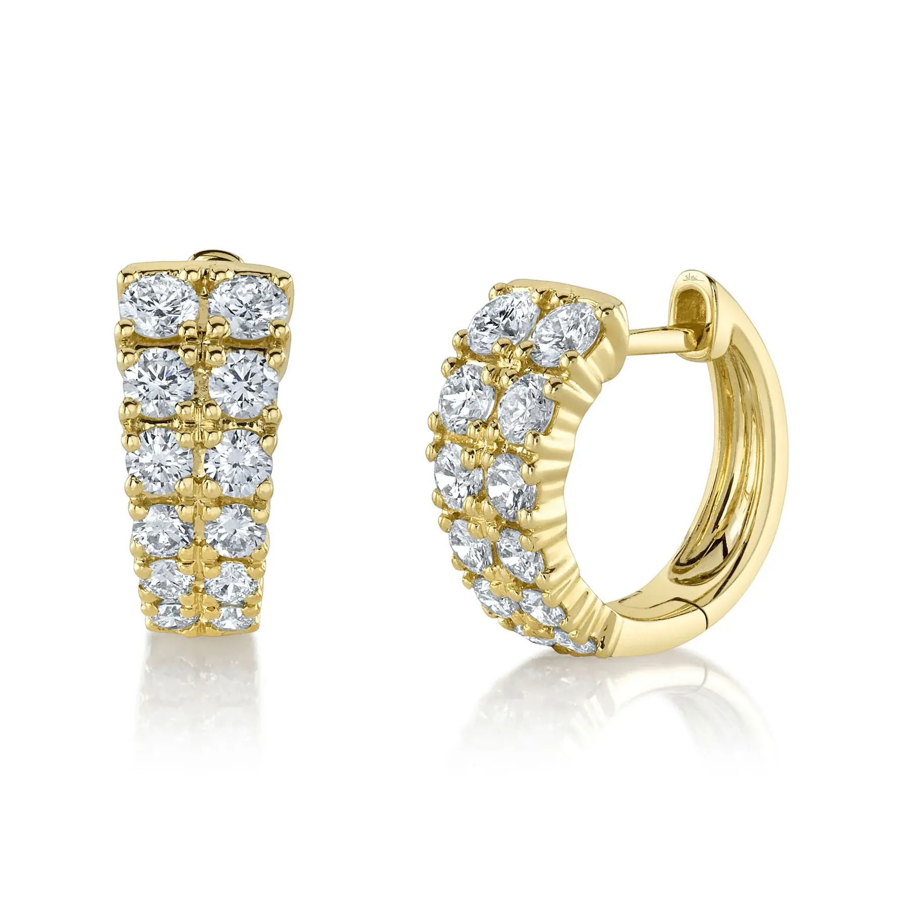 With its bold design, this piece commands attention and invites conversation at any event. All Shy Creation diamonds are natural and hand-selected. All stones are unique and hand set. As a result, you can expect slight variations in the shade, hue, tint of the color stones and stone count.-14k Yellow gold-Round Diamonds, 0.87Ct-Dimensions, 0.50"L / 0.20"WItem# 805-01581 Diamond Huggie Earrings