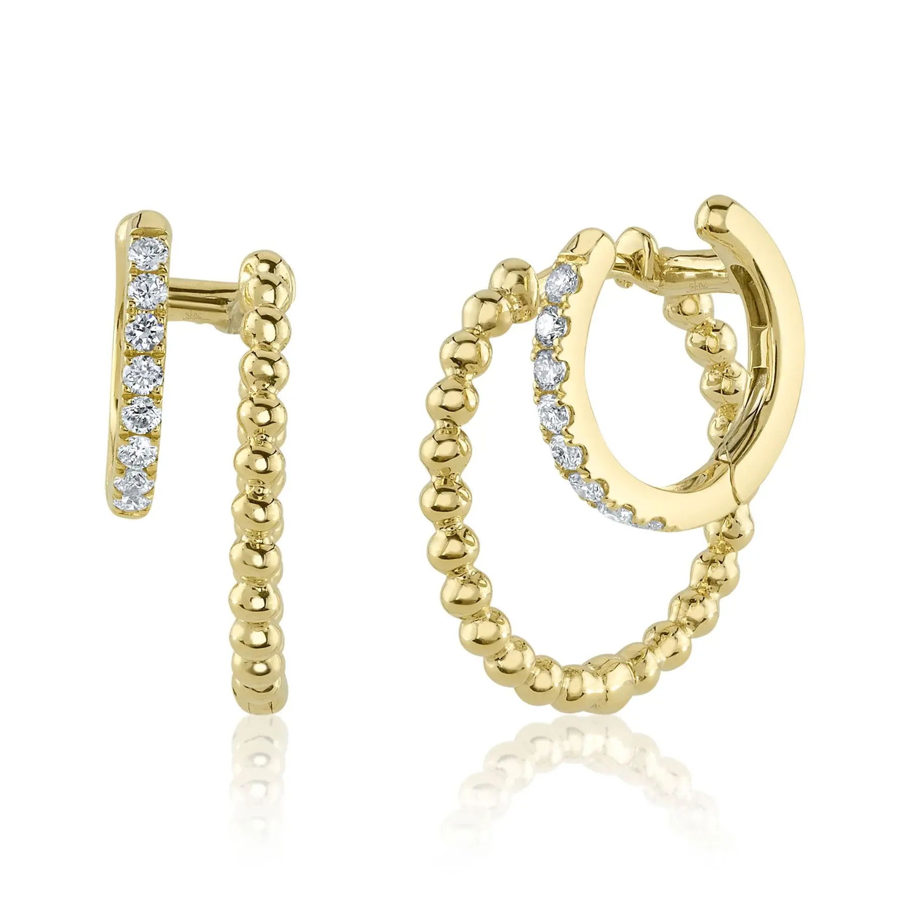 Experience both luxury and comfort with this timeless piece, designed for everyday elegance. All Shy Creation diamonds are natural and hand-selected. All stones are unique and hand set. As a result, you can expect slight variations in the shade, hue, tint of the color stones and stone count.-14k Yellow gold-Round diamonds, 0.18Ct-Dimensions, 0.70"L / 0.20"WItem# 805-01587 Diamond Double Huggie Earrings