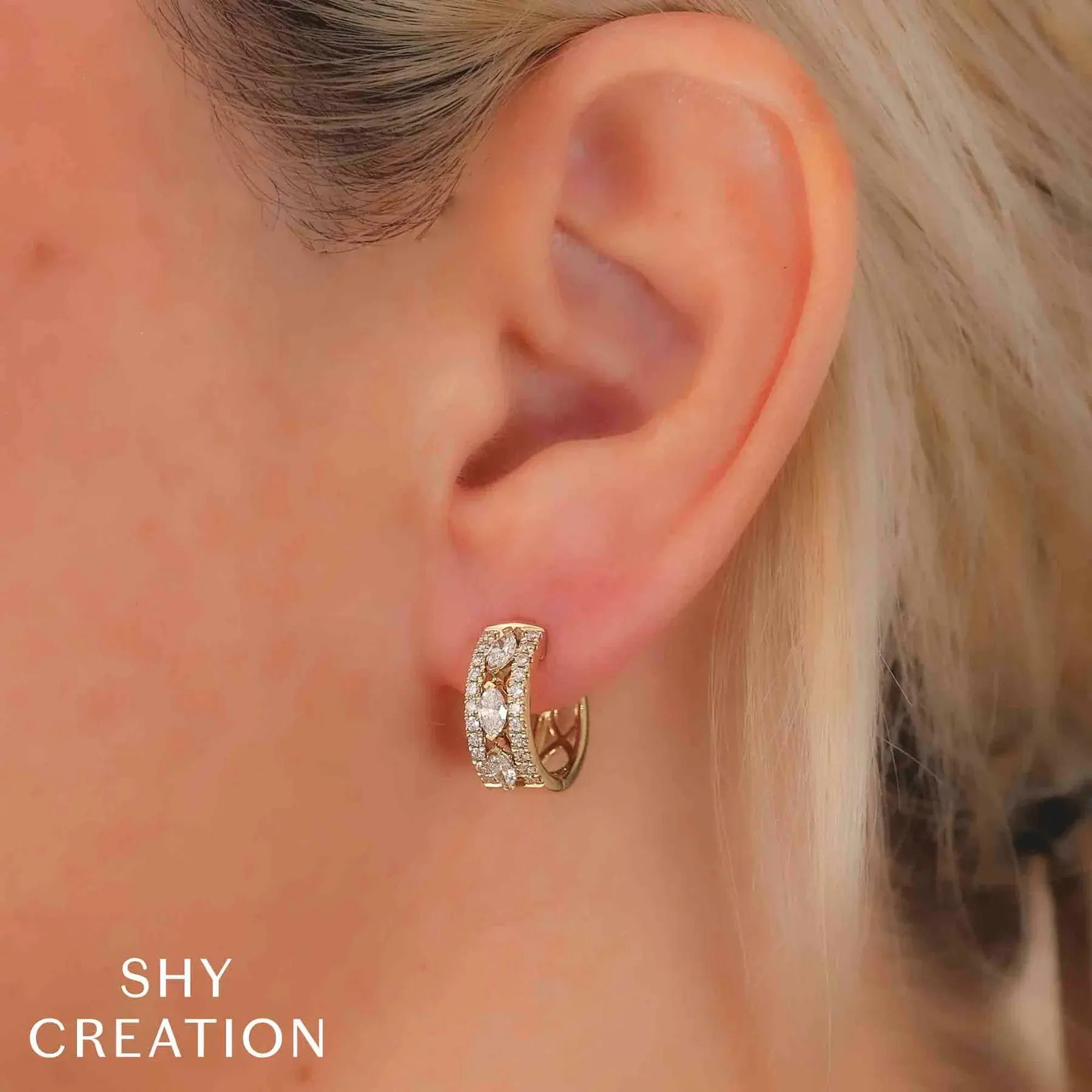 Designed for versatility, this piece complements your look whether it's for everyday wear or a night out. All Shy Creation diamonds are natural and hand-selected. All stones are unique and hand set. As a result, you can expect slight variations in the shade, hue, tint of the color stones and stone count.-14k Yellow gold-Round diamonds, 0.41cts-Marquise diamonds, 0.60cts-Dimensions, 0.60"L / 0.25"WItem# 805-01637 Diamond Marquise Hoop Earrings