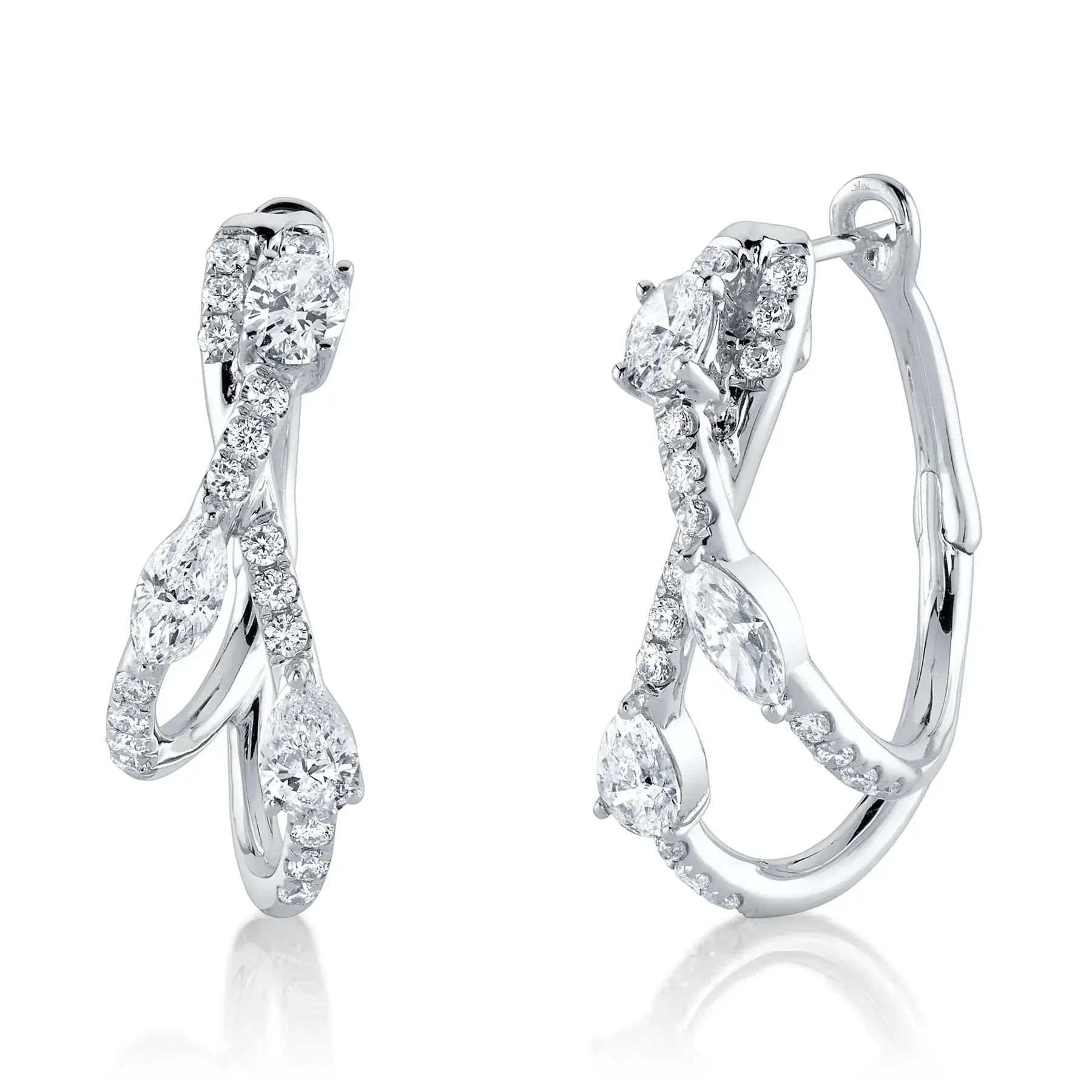 This striking piece guarantees to turn heads and start conversations wherever you go. All Shy Creation diamonds are natural and hand-selected. All stones are unique and hand set. As a result, you can expect slight variations in the shade, hue, tint of the color stones and stone count.-14k White gold-Marquise diamonds, 0.38cts-Pear diamonds, 0.38cts-Oval diamonds, 0.44cts-Round diamonds, 0.38ctsItem# 805-01638 Diamond Oval Hoop Earrings