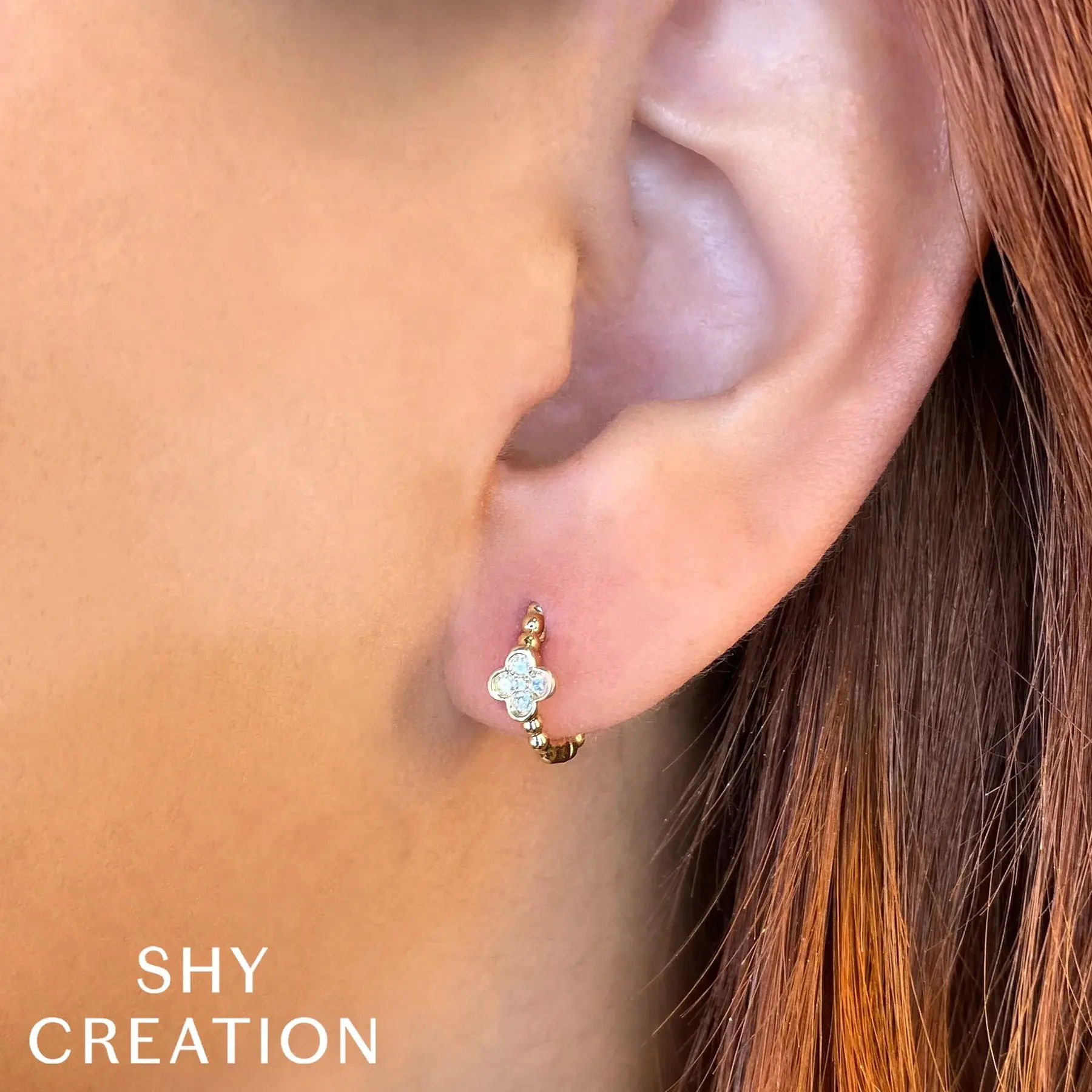 This simple yet flawless piece delivers effortless style, making it perfect for everyday wear. All Shy Creation diamonds are natural and hand-selected. All stones are unique and hand set. As a result, you can expect slight variations in the shade, hue, tint of the color stones and stone count.-14k White gold-Round diamonds, 0.10ctsItem# 805-01641 Diamond Clover Huggie Earrings