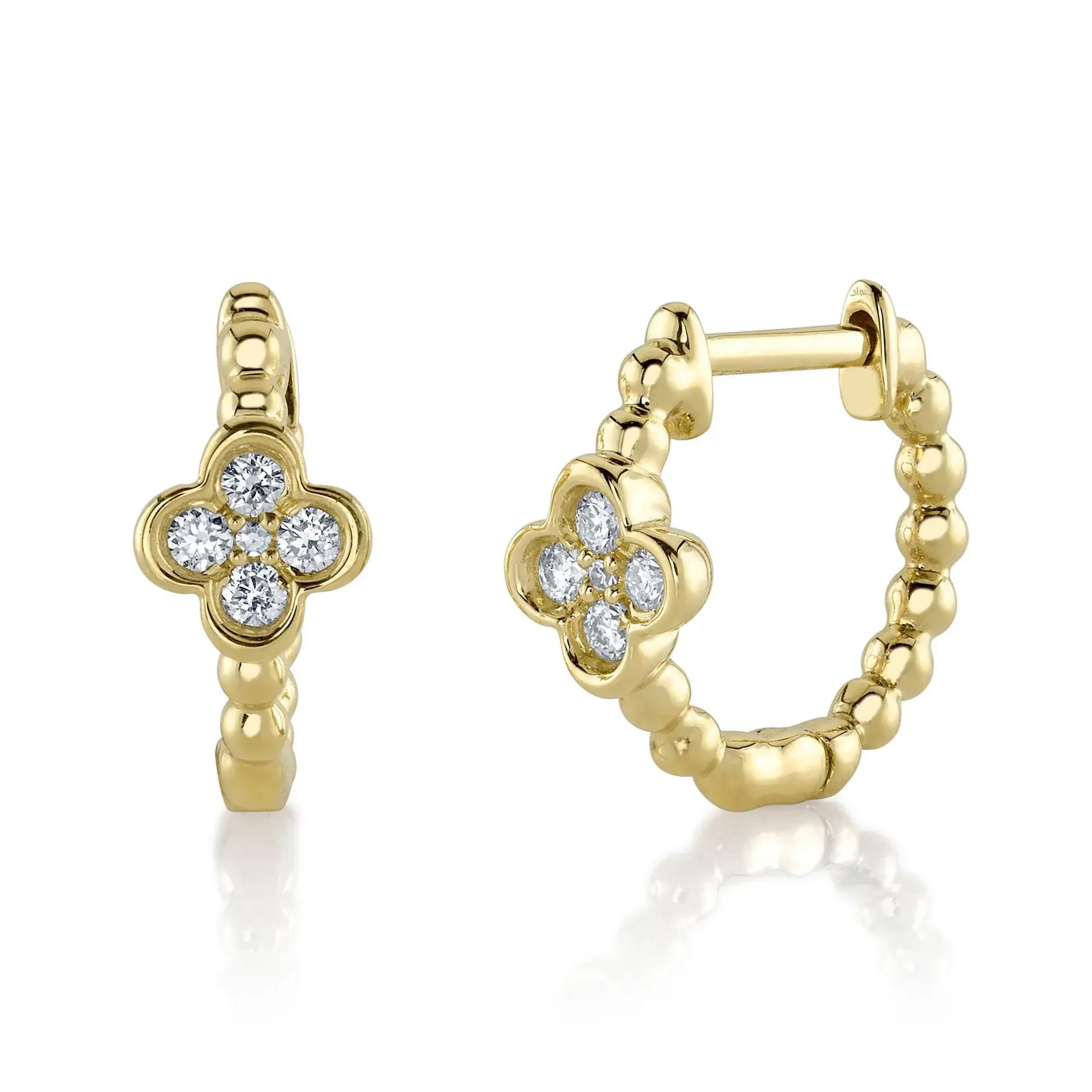 This simple yet flawless piece delivers effortless style, making it perfect for everyday wear. All Shy Creation diamonds are natural and hand-selected. All stones are unique and hand set. As a result, you can expect slight variations in the shade, hue, tint of the color stones and stone count.-14k Yellow gold-Round diamonds, 0.10cts-Dimensions, 0.60"L / 0.30"WItem# 805-01642 Diamond Clover Huggie Earrings