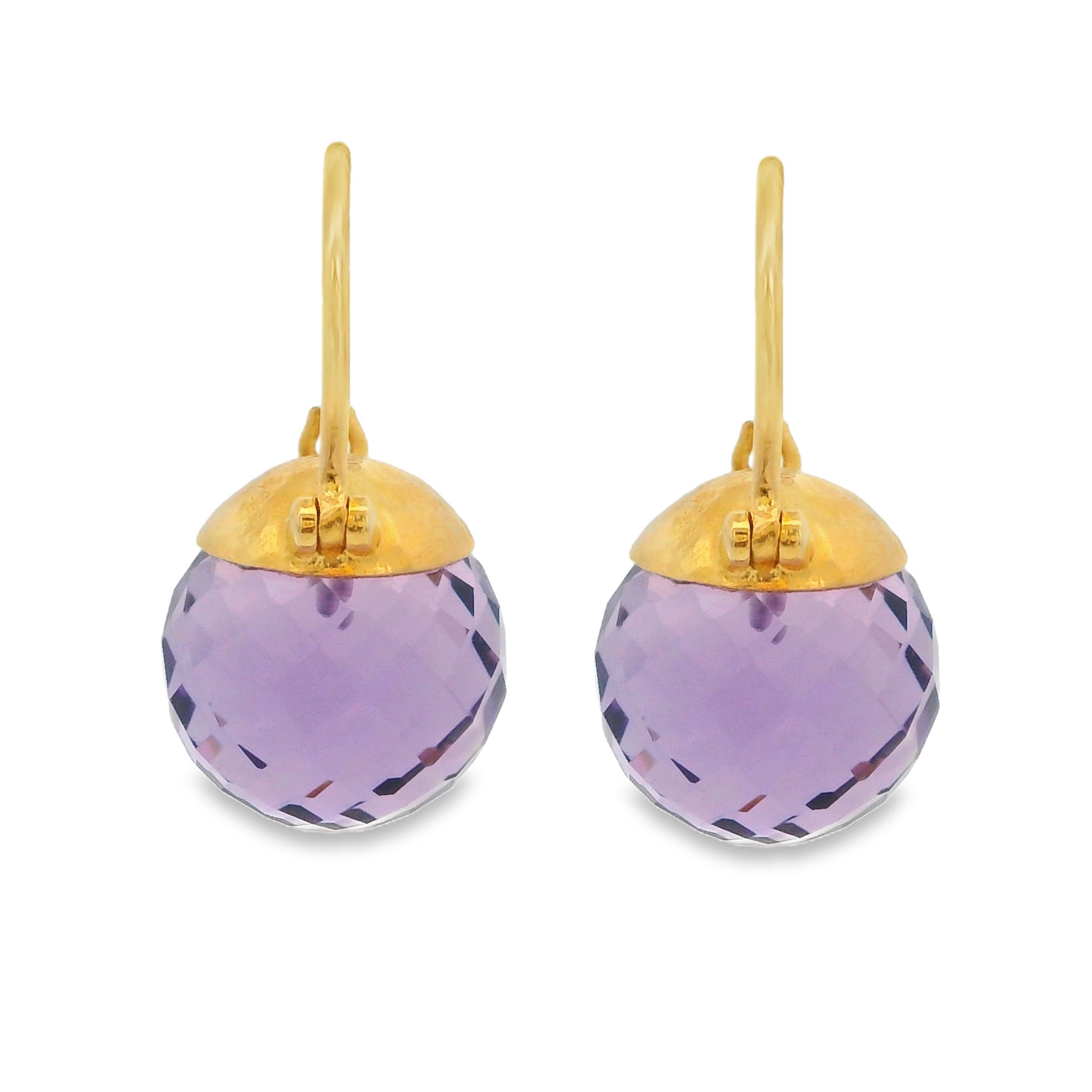 These earrings feature vibrant amethysts set in gold, offering a rich pop of color and timeless elegance. Perfect for adding a touch of sophistication to any outfit.-18k Yellow gold-Amethyst, 18.85ctsItem# 001-805-01687 Amethyst Earrings