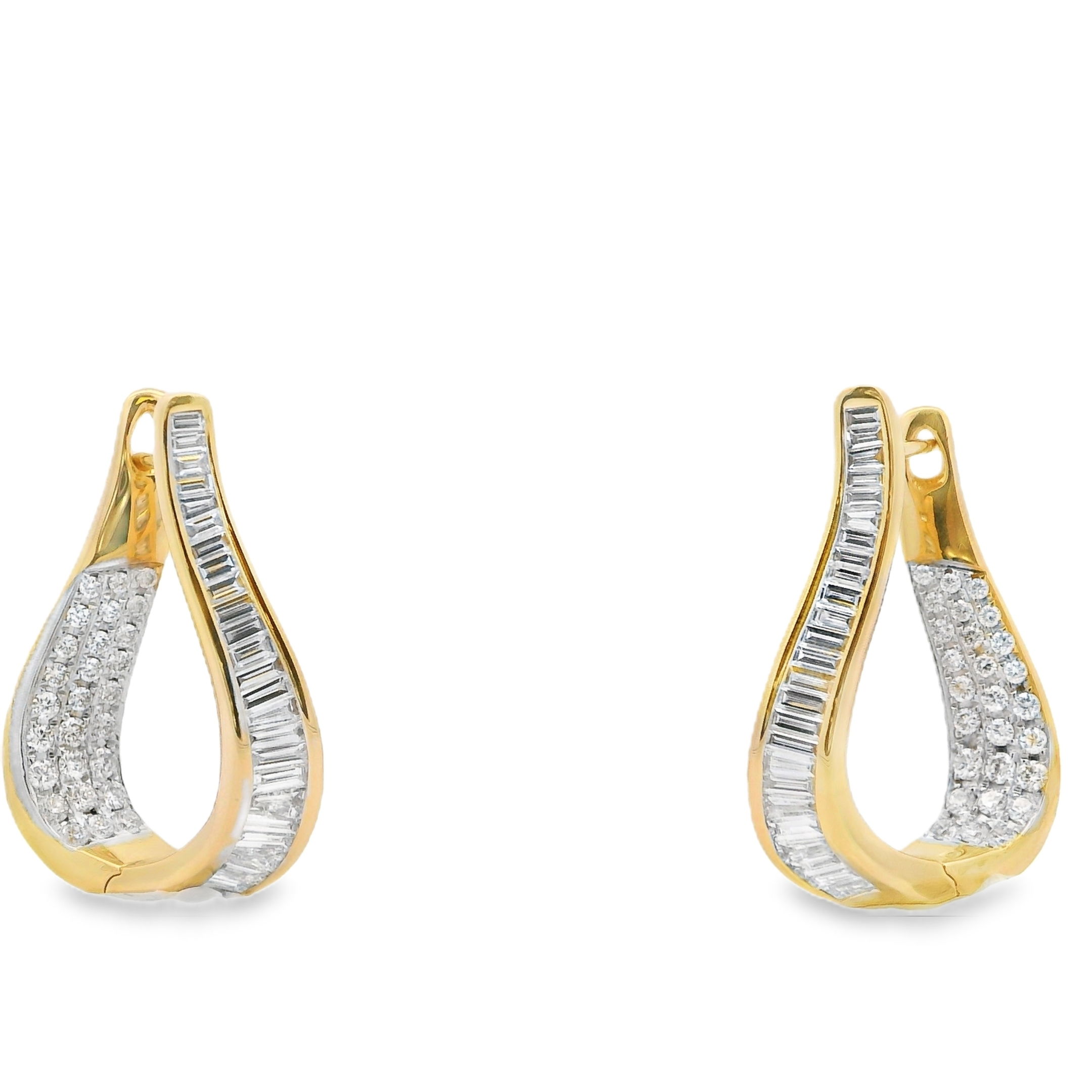 These twisted inside out hoops put a fresh spin on classic sparkle. Featuring a dynamic mix of baguette and round diamonds, they catch the light from every angle with their sculptural silhouette and refined edge. Bold, brilliant, and endlessly wearable.-18k Yellow gold -Round diamonds, 0.63cts-Baguette diamonds, 0.81ctsItem# 805-01770 Twisted Inside Out Hoops
