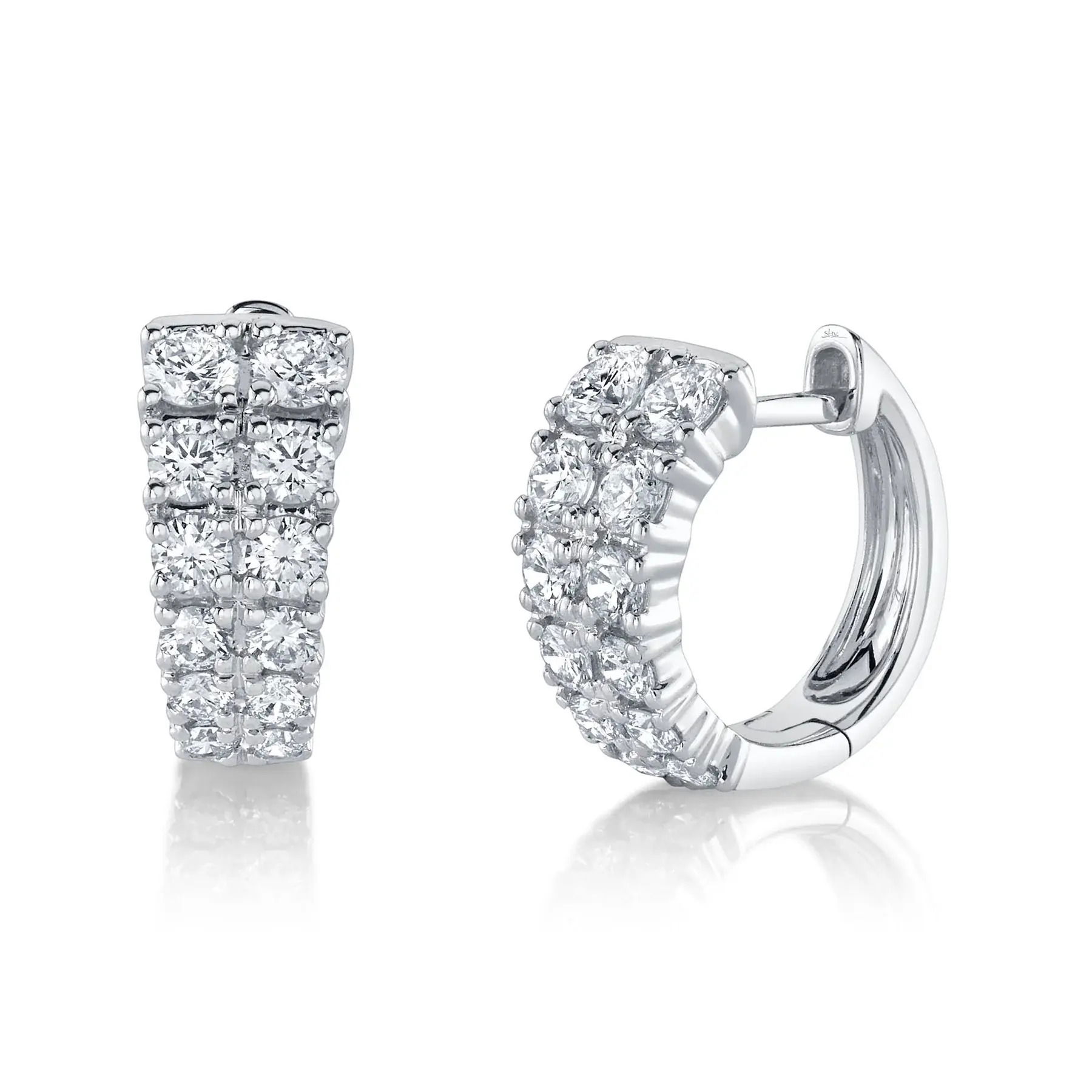 With its bold design, this piece commands attention and invites conversation at any event. All Shy Creation diamonds are natural and hand-selected. All stones are unique and hand set. As a result, you can expect slight variations in the shade, hue, tint of the color stones and stone count.-14k White gold-Round Diamonds, 0.87cts-Dimensions, 0.50"L / 0.20"WItem# 805-01775 Diamond Huggie Earrings