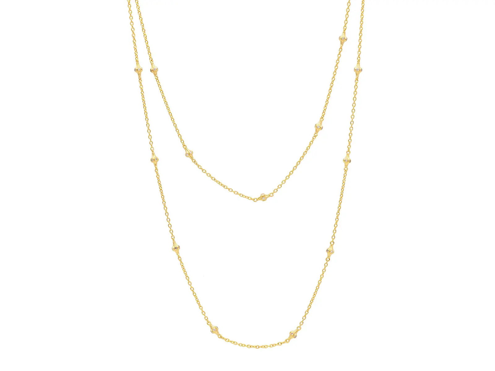 This 22k yellow gold station necklace features a delicate chain accented with diamonds for a refined, understated look. Its versatile length makes it perfect for layering or wearing alone.-22k Yellow gold-Round diamonds, 1.62cts-Length 36"Item# 001-807-00819 Gold Station Necklace