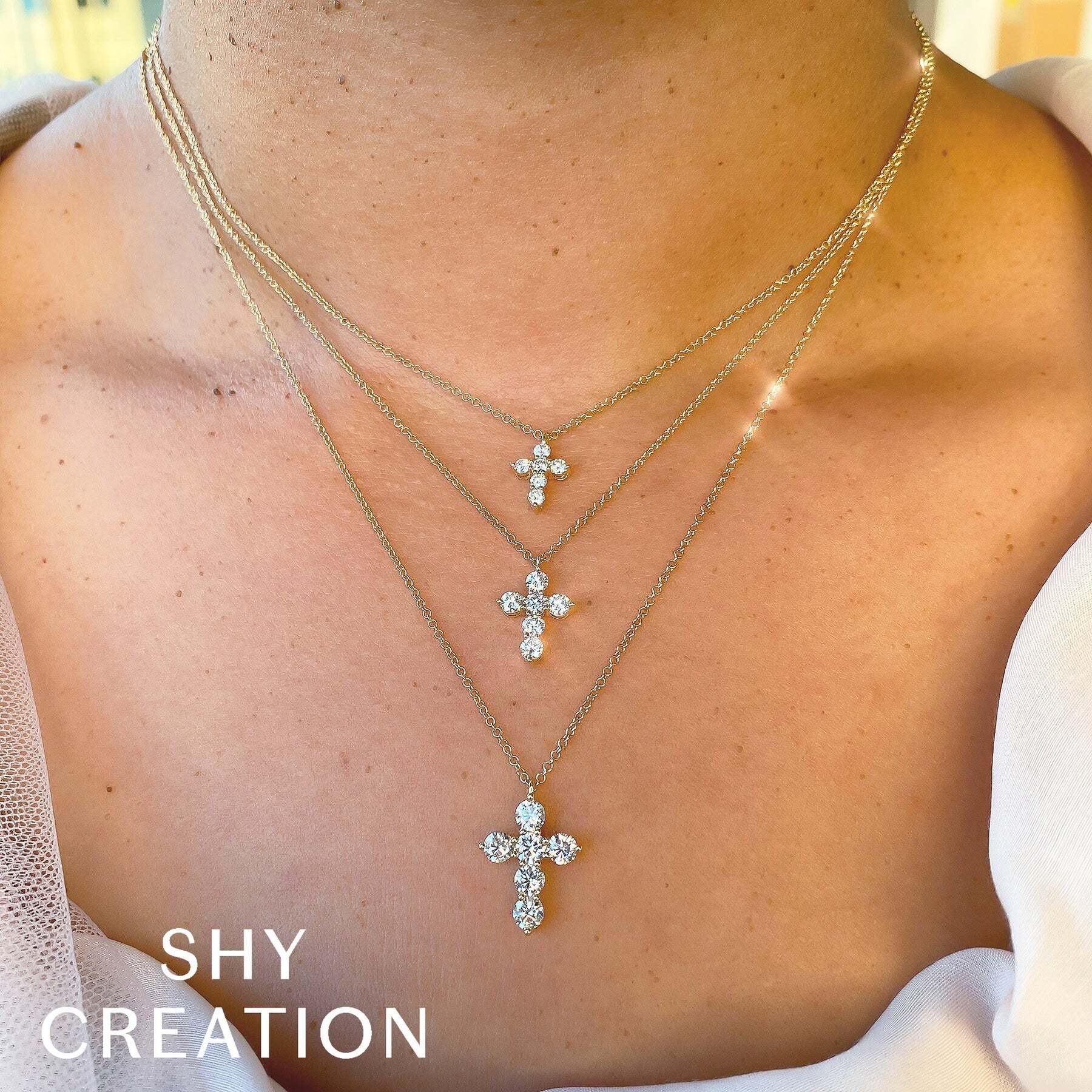 The perfect blend of simplicity and sophistication, this piece will enhance any outfit. All Shy Creation diamonds are natural and hand-selected. All stones are unique and hand set. As a result, you can expect slight variations in the shade, hue, tint of the color stones and stone count.-14k White gold-Round diamonds, 1.10cts-Chain length, 15"-18" on adjustable chainItem# 807-00992 Diamond Cross Necklace