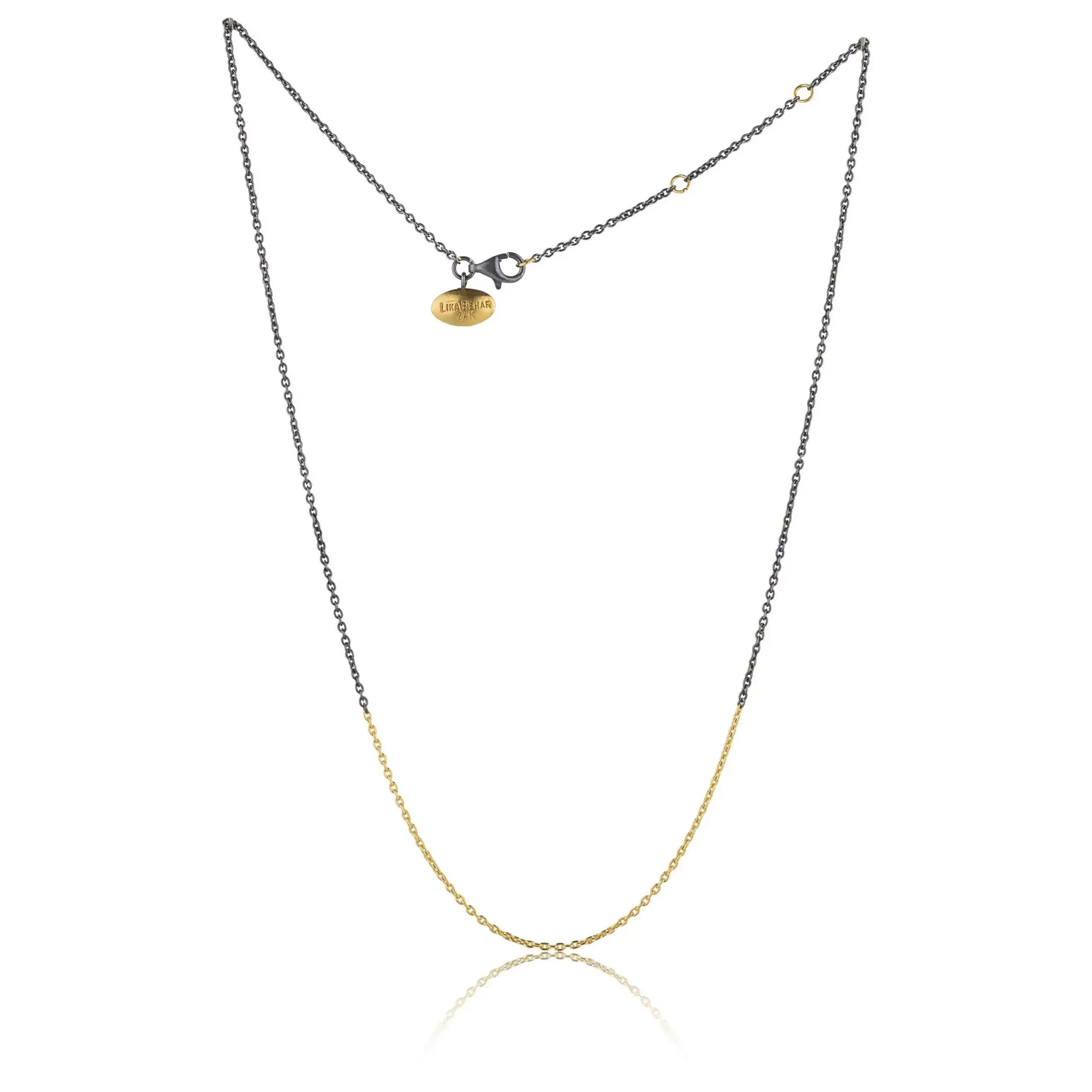 Introducing our Mixed Metal Rolo Chain Necklace—a harmonious blend of sterling silver and 24k yellow gold. The Rolo chain design ensures durability and flexibility, making it a versatile addition to your jewelry collection with adjustable length.?-24k Yellow gold -Oxidized silver-Length 16", 17", 18" Item# 001-807-01020 Silver and Gold Mixed Rolo Chain