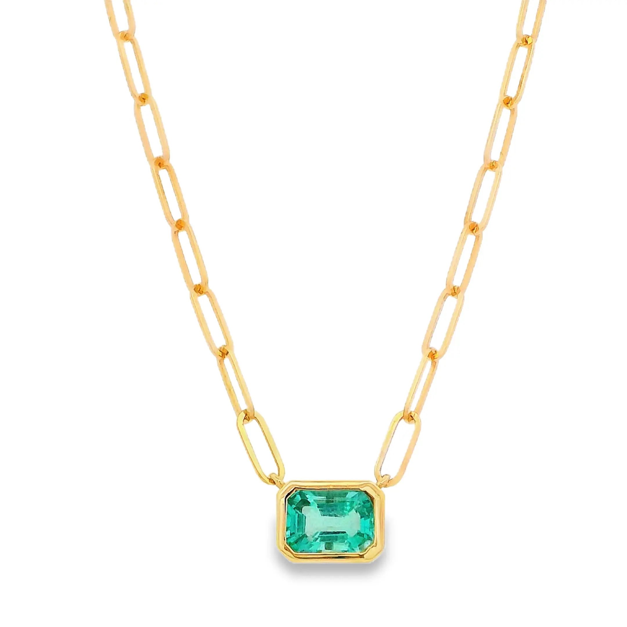 This gold link chain features a single emerald pendant, showcasing the vibrant green hue of the stone against the warm glow of polished gold. Its minimalistic design adds a touch of timeless elegance and sophistication to any look.-14k Yellow gold-Emerald green emerald, 0.81ctsItem# 807-01242 Emerald Necklace