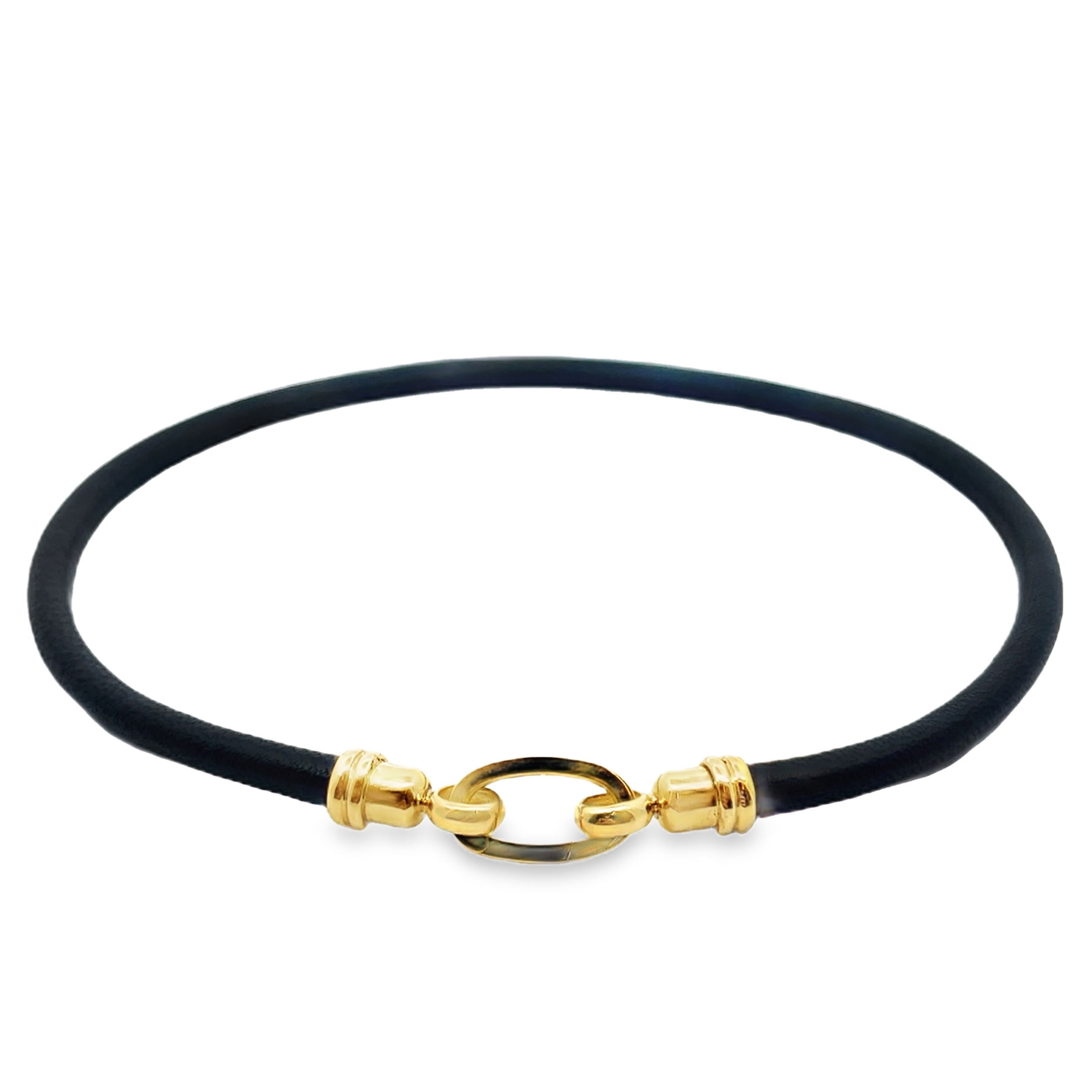 This necklace features black leather with 18k yellow gold accents, offering a sleek and modern look. Its minimalist design is perfect on its own or can be customized by adding a pendant for a more personalized style.-18k Yellow gold-Black leather-Length 18”Item# 807-01253 Black Leather Necklace