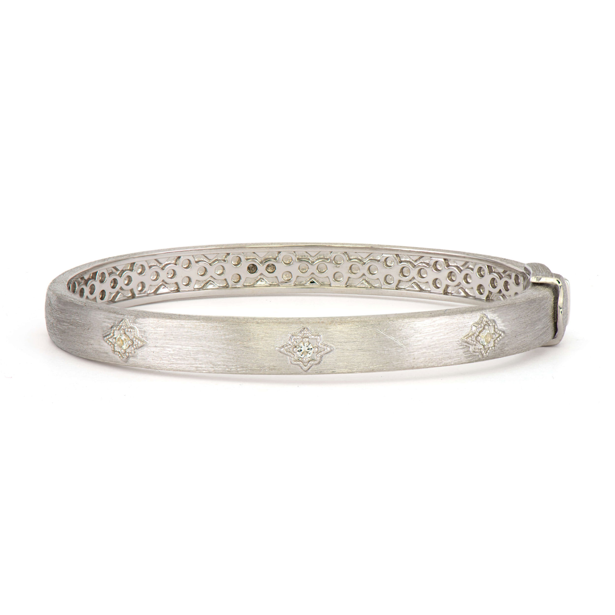Combining classic elegance with on trend shapes and styles, JFJ offers something for women of all ages. From the Moroccan Collection, this bangle features the signature brushed JFJ finish in a soft brushed texture with stars set into the band that adds some sparkle.-Sterling silver-White topaz, 0.09cts-Size, 6.5Item# 808-00804 Star Wide Bangle