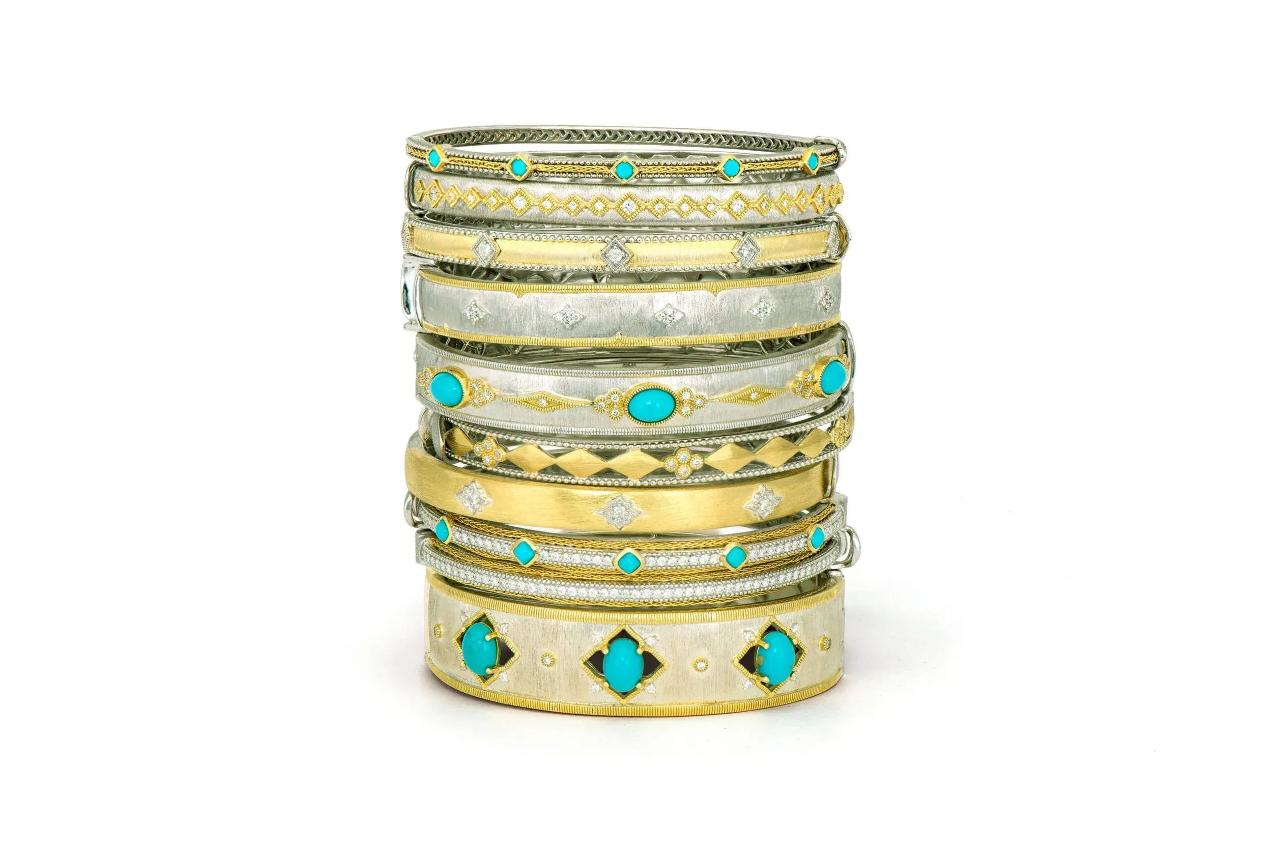 Combining classic elegance with on trend shapes and styles, JFJ offers something for women of all ages. From the Mixed Metal Collection, this bangle features three cabochon turquoise gemstones with white diamond trios on both sides and elongated white diamond kites in 18k yellow gold trim on a sterling silver band. All set in the signature brushed JFJ finish.-18k Yellow gold-Sterling silver-Round diamonds, 0.22cts-TurquoiseItem# 808-008878 Mixed Metal Turquoise Bangle