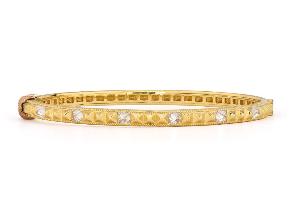 Combining classic elegance with on trend shapes and styles, JFJ offers something for women of all ages. This bangle promises just that, on trend shapes and styles. Mix and match this piece with other JFJ bangles to create one-of-a-kind look unique to you.-18k Yellow gold-Round white diamonds, 0.96cts-Size, 6.5Item# 808-00929 Brushed Diamond Bangle