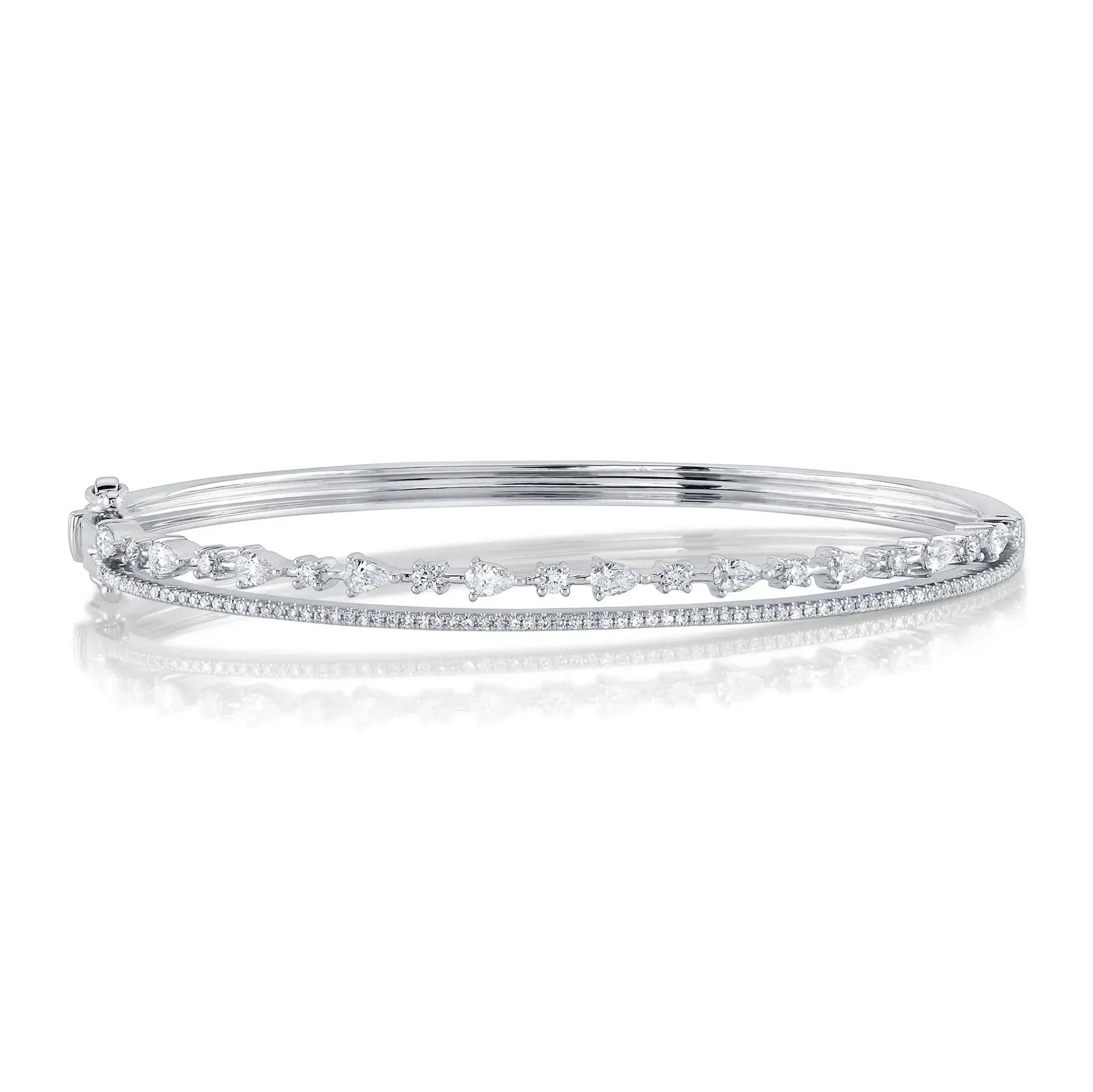 This versatile piece easily transitions from day to night, making it perfect for any occasion. All Shy Creation diamonds are natural and hand-selected. All stones are unique and hand set. As a result, you can expect slight variations in the shade, hue, tint of the color stones and stone count.-14k White gold-Round Diamonds, 0.40cts-Pear Diamonds, 0.53Ct-Dimensions, 0.20"WItem# 808-00951 Diamond Bangle