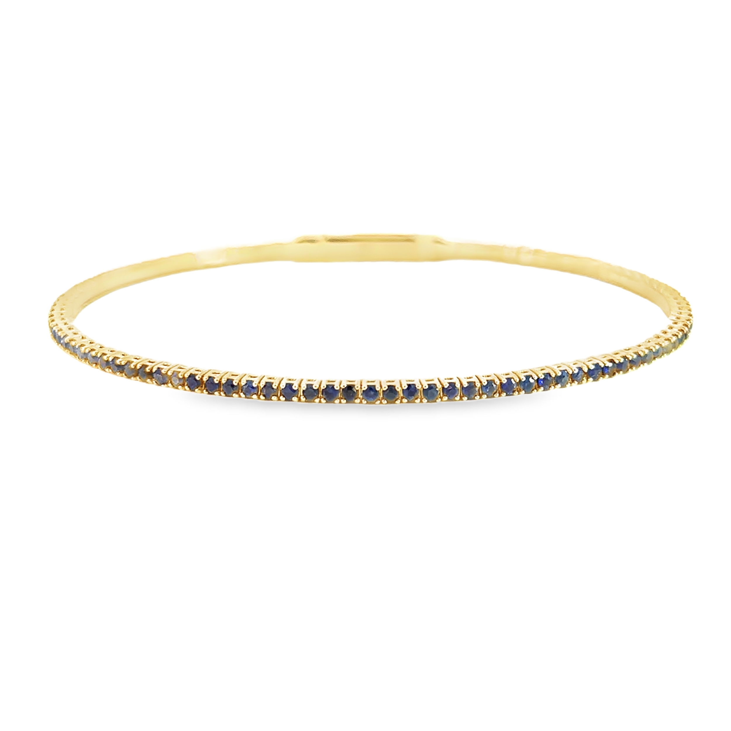 This bangle features a seamless row of sparkling sapphires set in an elegant and timeless design. Perfect for any occasion, it adds a touch of brilliance and sophistication to your jewelry collection.-14k Yellow gold-Round blue sapphires, 1.67ctsItem# 808-00959 Blue Sapphire Bangle