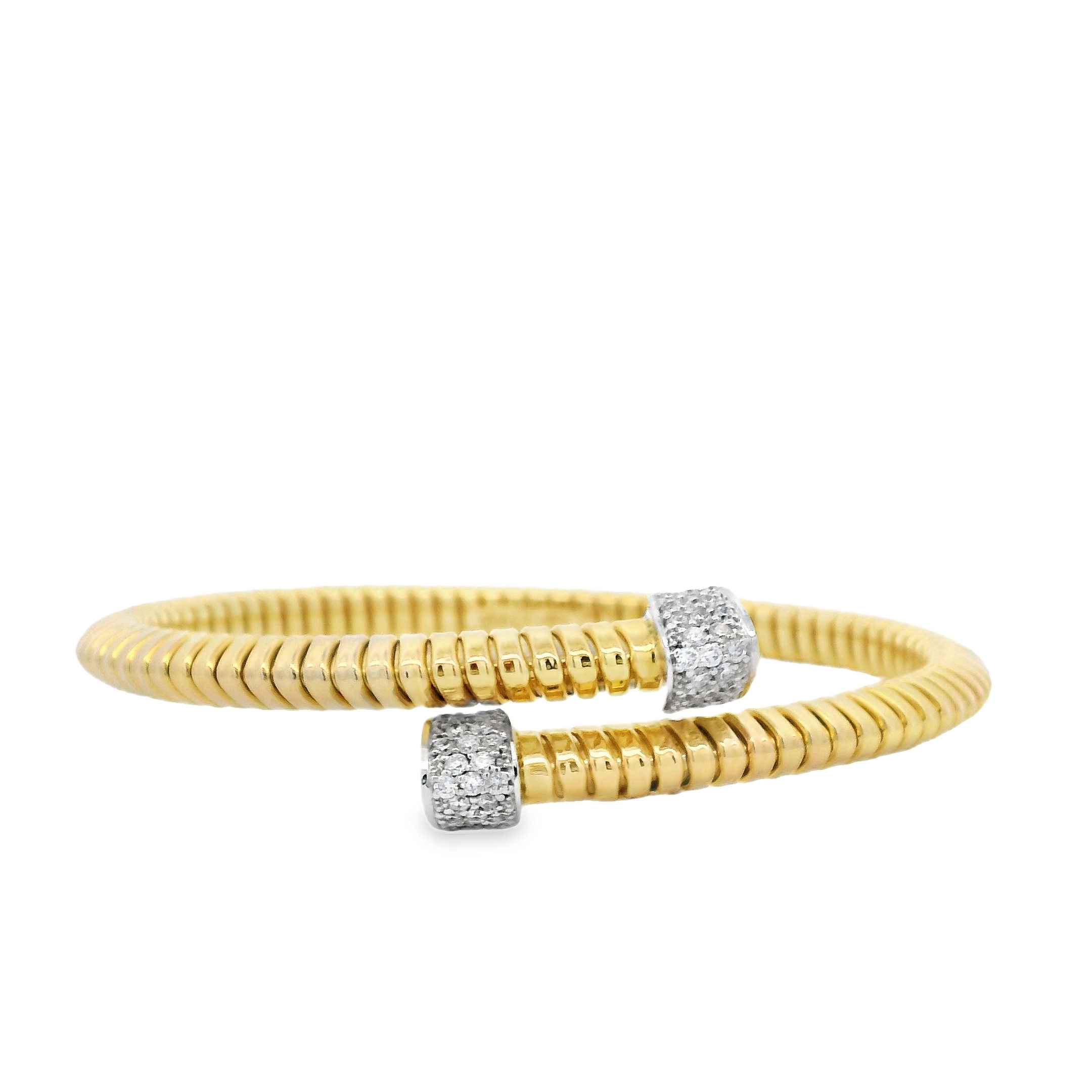 Sleek and sculptural, this bypass coil bangle wraps the wrist in modern elegance. Accented with diamonds on each end, it delivers just the right touch of sparkle while maintaining a bold, minimalist silhouette. A versatile piece perfect for stacking or wearing solo.-18k Two-Tone Yellow and White gold-Round diamonds, 0.57ctsItem# 808-00979 Bypass Coil Bangle