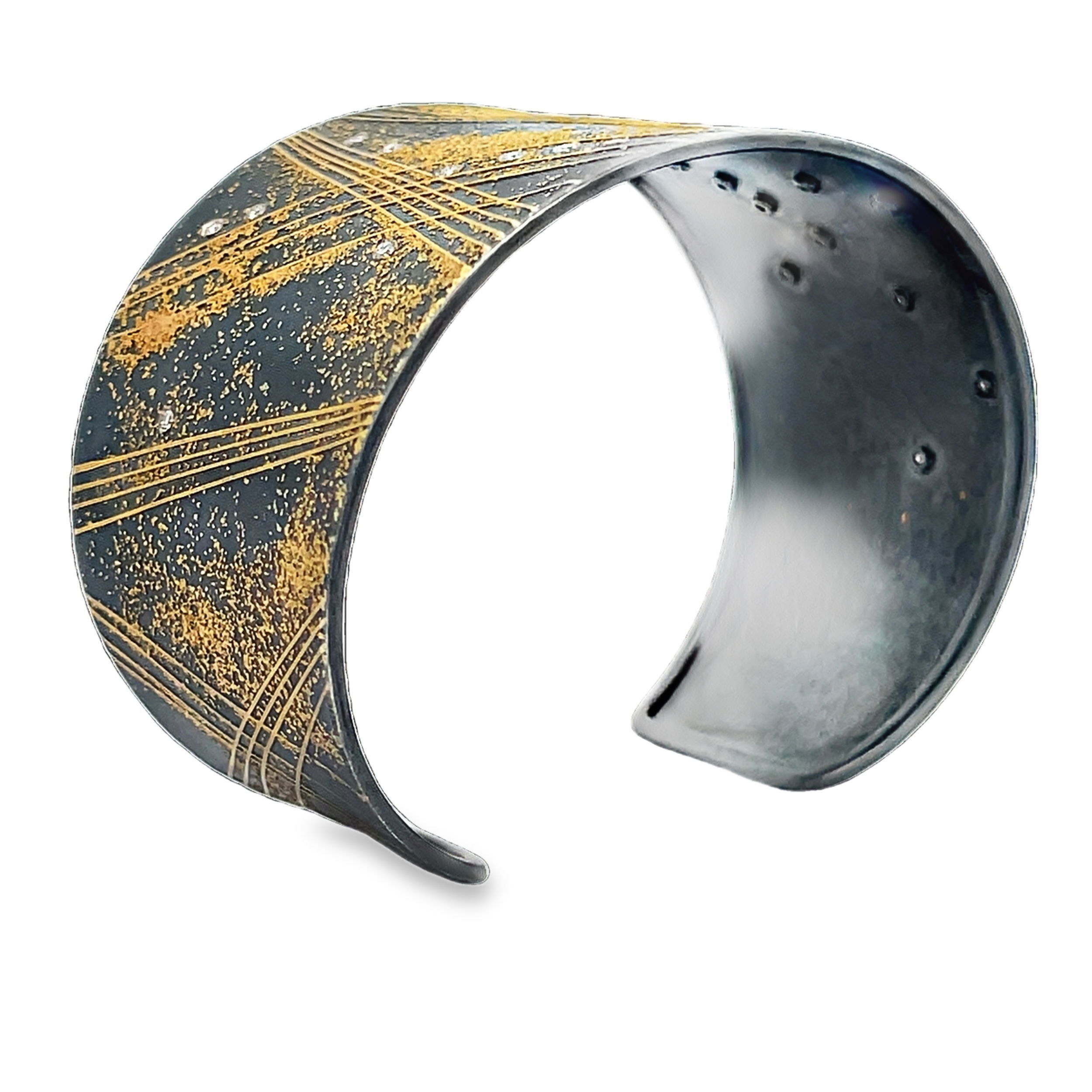 With inspiration rooted in natural structures and growth patterns, Peter Schmid finds his muse within nature and urban environments themselves. Showcasing a unique approach to jewelry design, the world of Atelier Zobel boasts creativity and inspiration within every piece.-24k Yellow gold-Sterling silver-Round diamonds, 0.27ctsItem# 808-01203 Diamond & 24K Cuff