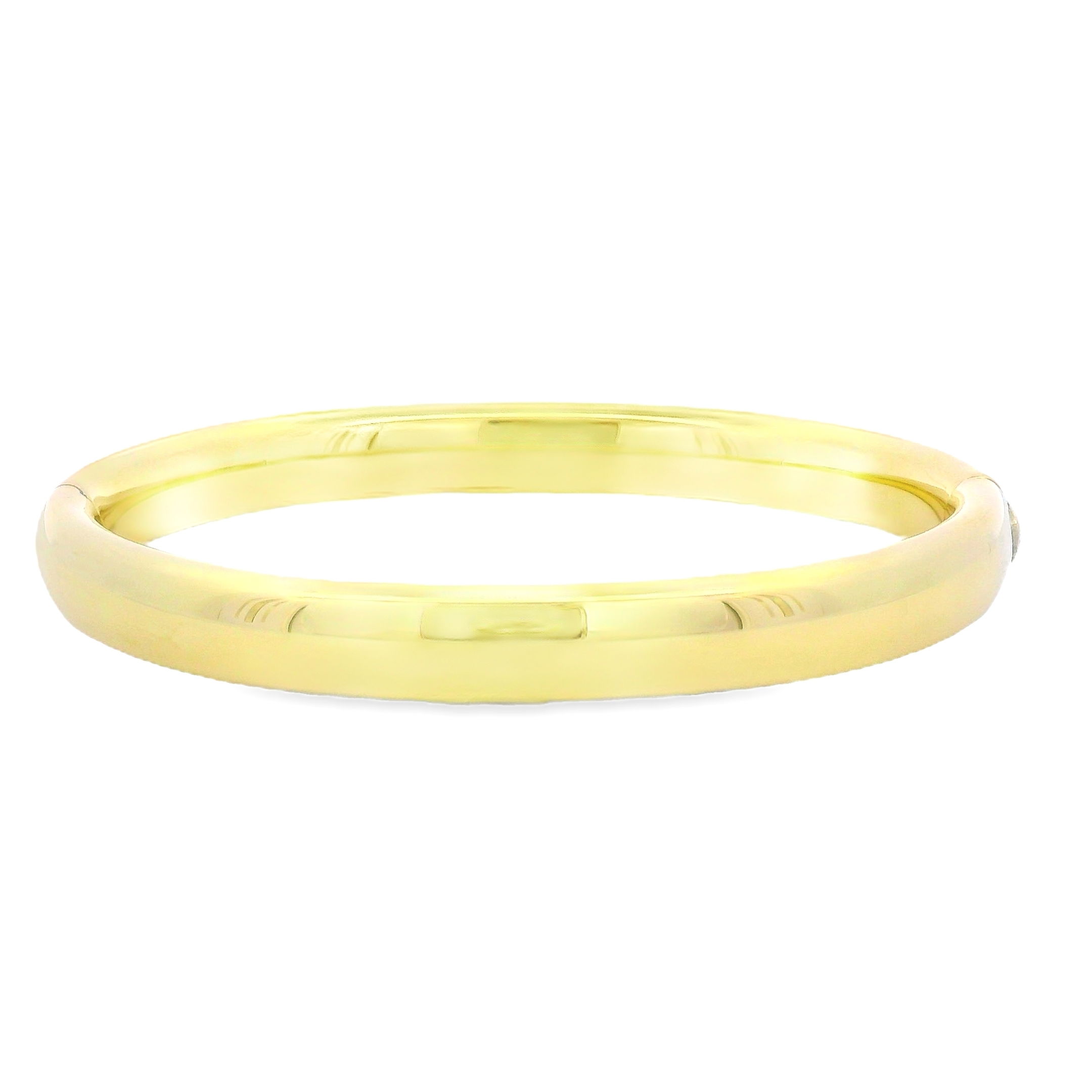 This oval bangle combines bold style with refined elegance, featuring a smooth, polished surface. Its strong, sleek design also makes it perfect for stacking with other bangles or bracelets, allowing for a customizable look.-18k Yellow gold-Hinged-Size 8Item# 808-01207 Oval Bangle