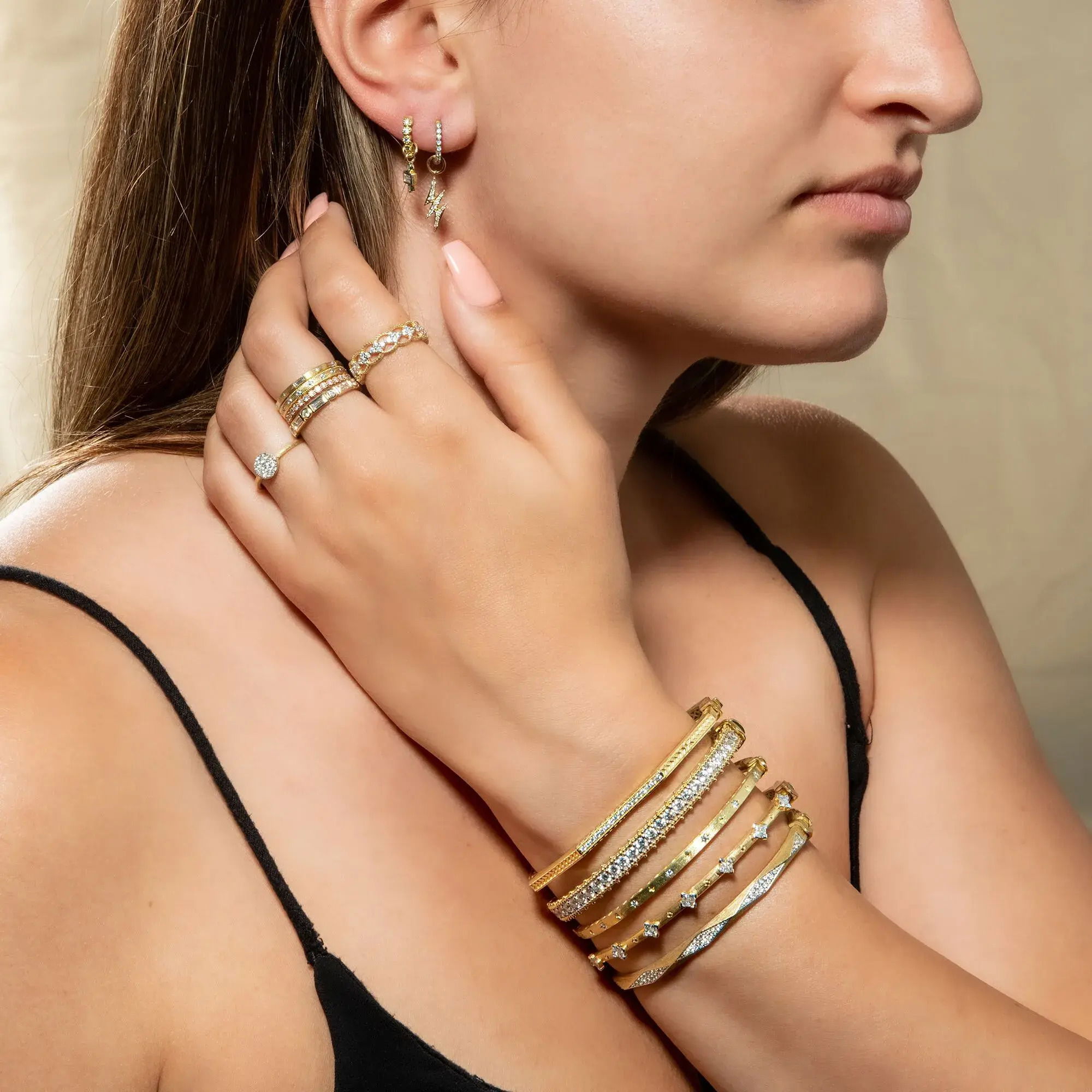 Combining classic elegance with on trend shapes and styles, JFJ offers something for women of all ages. From the Petites Collection, this charm features pave round diamonds set in an 18K yellow gold lightning bolt design. Earring charms sold as singles. Hoops and earring charms sold separately.-18k Yellow gold-Round white diamonds, 0.04ctsItem# 809-00535 Petite Lightning Bolt Earring Charm
