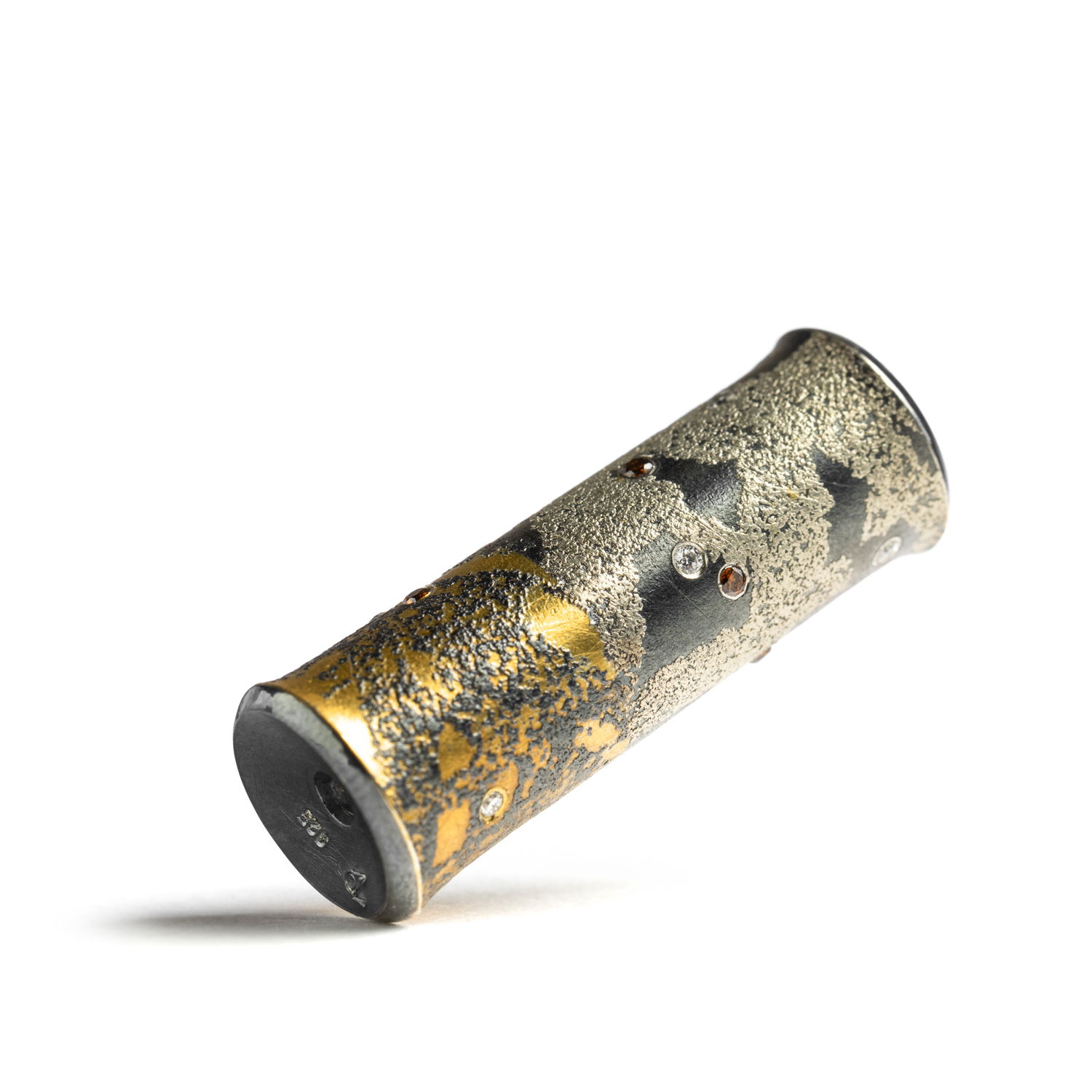 Functional art in its purest form. This clasp in oxidized sterling silver and 24k gold, is a mechanical innovation disguised as wearable sculpture. Designed to connect with Atelier Zobel’s modular Vario chains and pendants, yet singular enough to stand on its own.-Sterling silver & 24k yellow gold-Round white & pink diamonds, 0.17cts Item# 811-00270 Vario Connector Clasp
