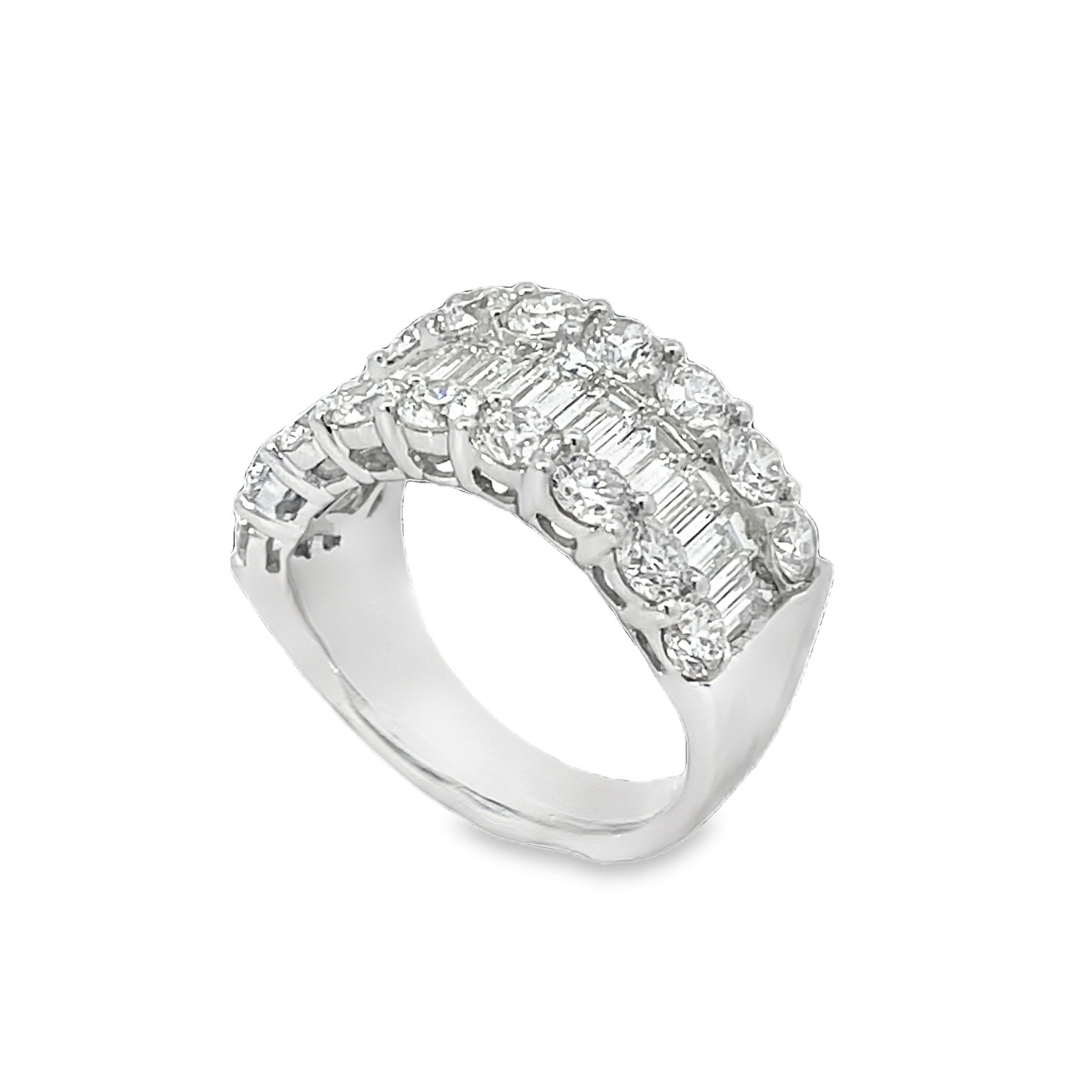 Featuring a classic design with a modern twist of rows of round and baguette cut diamonds, this piece is a beautiful addition to any ring stack or a stunning standalone.-18k White gold-Round diamonds, 2.77cts-Baguette diamonds, 1.90cts-Size, 7.5Item# 130-01155 Triple Row Diamond Ring