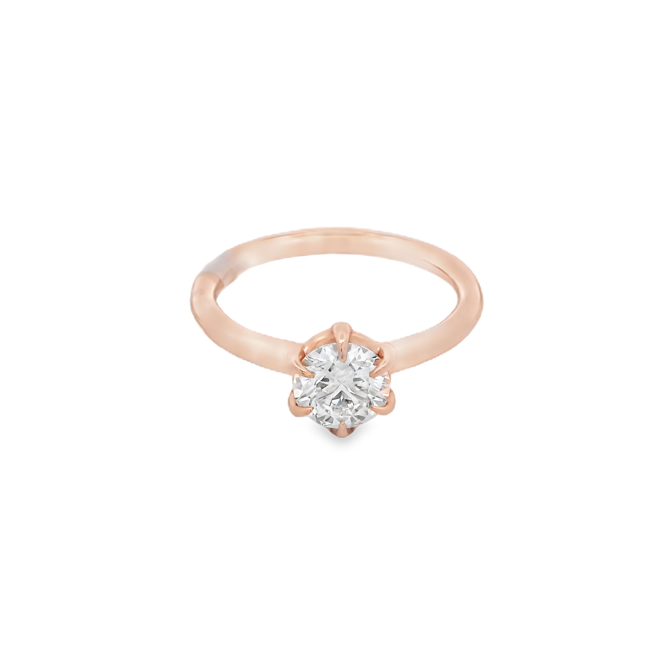 Timeless and refined, this six-prong 14k Rose gold solitaire engagement ring offers a classic setting that highlights the brilliance of your center stone. The sleek design draws all eyes to the diamond, making it a perfect choice for those who appreciate understated elegance with lasting style. (Center stone not included)-14k Rose gold-Size 6.5, Contact for sizing optionsItem# 140-2000001 Rose Gold Solitaire