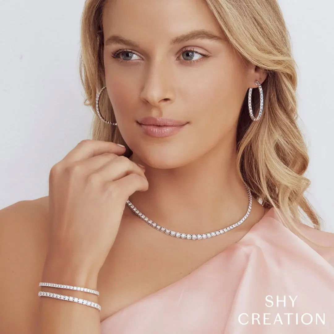 Wear it alone for a subtle statement or layered with other pieces—this is a must-have for your collection. All Shy Creation diamonds are natural and hand-selected. All stones are unique and hand set. As a result, you can expect slight variations in the shade, hue, tint of the color stones and stone count.-14k White gold-Round diamonds, 1.00cts-Dimensions, 7.00"L / 0.13"W-Size SItem# 170-2000001 Diamond Tennis Bracelet