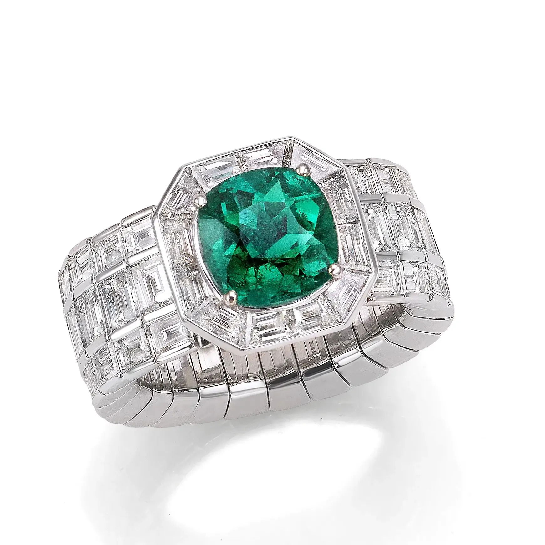 This Xpandable Emerald Ring is a standout-piece that would be a beautiful addition to anyones jewelry box. Picchiotti's Xpandable collection, crafted with the customer’s comfort in mind, offers fine jewelry featuring rings and bracelets that effortlessly adjust for a perfect fit.-18k White gold-Cushion Emerald, 2.52ct-Baguette diamonds, 4.56cts-Contact for sizing options.Item# 200-01080 Xpandable Emerald Ring
