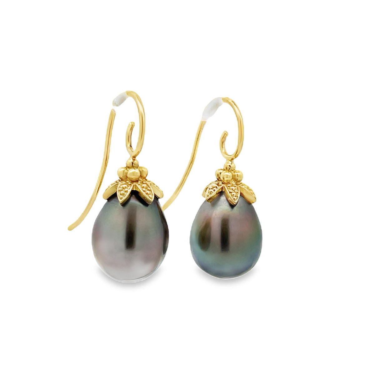 These earrings feature lustrous Tahitian pearls set in 18k yellow gold, offering a stunning contrast between the deep-toned pearls and the warm gold. Their timeless design brings an elegant touch to both everyday wear and special occasions.-18k Yellow gold-Tahitian pearlsItem# 310-00291 Anne Earrings