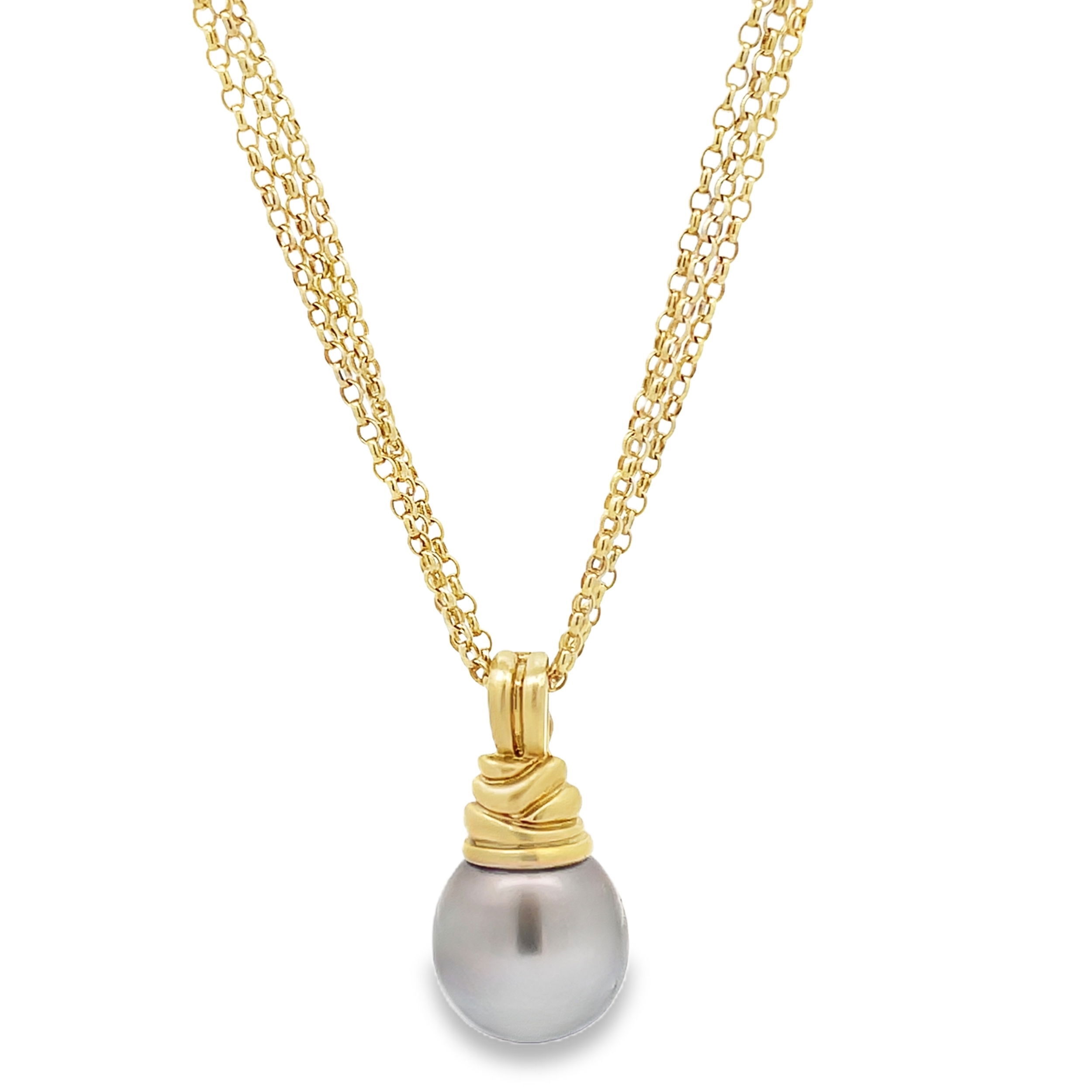 This Tahitian pearl pendant, set in 18k yellow gold, showcases the natural beauty of its rich, dark luster. A perfect balance of elegance and refinement, it's an exquisite piece that adds timeless sophistication to any wardrobe.-18k Yellow gold-Satin Finish Bail-Tahitian Pearl 17x18mmItem# 320-00064 Audrey Pendant 2.0