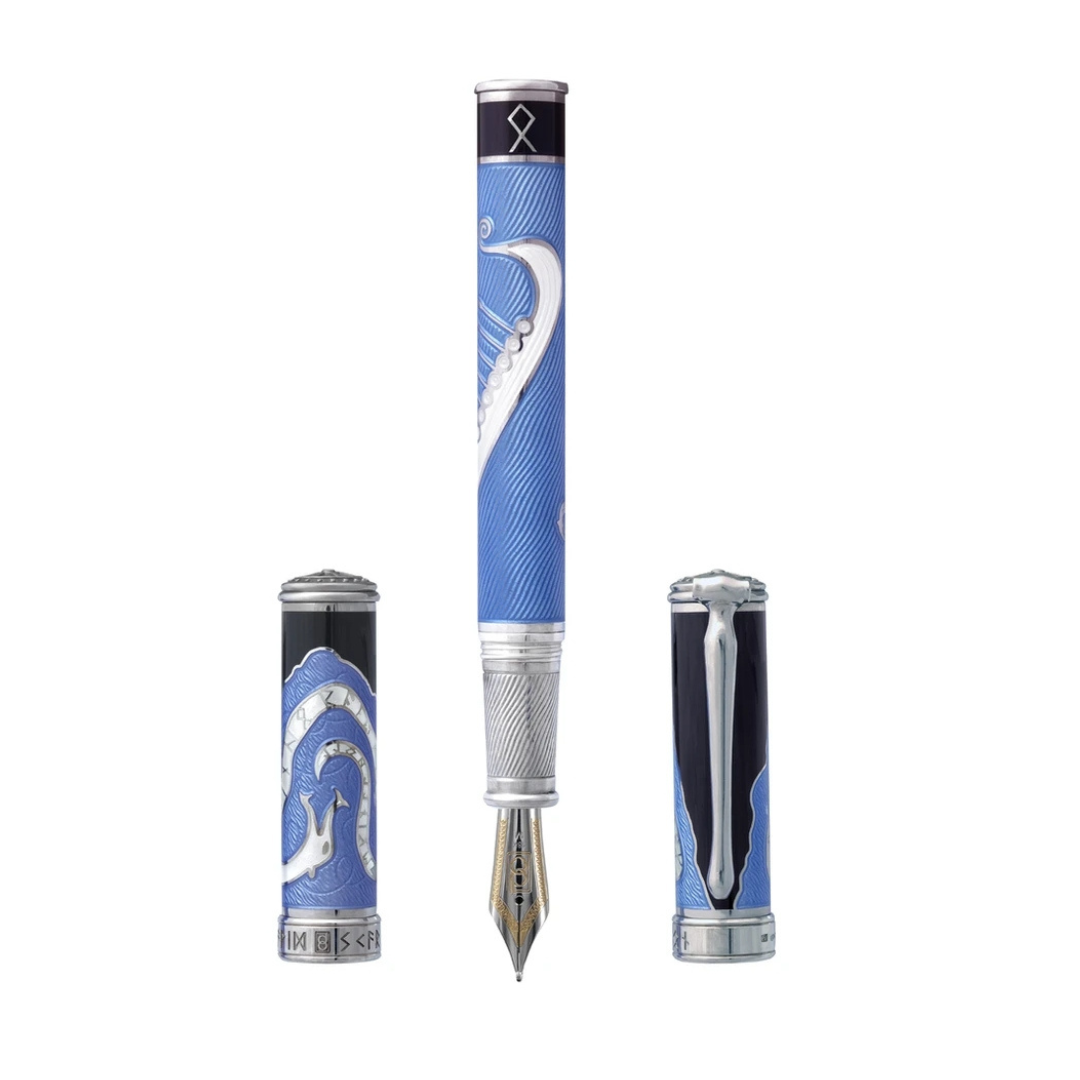 The Valhalla Odin Pen by David Oscarson is a limited-edition fountain pen, one of only 88 pieces, crafted with precision and elegance. Featuring a rhodium vermeil finish and intricate Norse-inspired designs, this pen honors the mighty god Odin. Perfect for discerning collectors, it offers flawless performance and exquisite detailing, making it a timeless addition to any collection. Whether as a distinguished gift or a personal treasure, the Valhalla Odin Pen adds a touch of the divine to your writing experience.-Rhodium Vermeil-EnamelItem# 002-750-00016 Valhalla Odin Pen 52/88