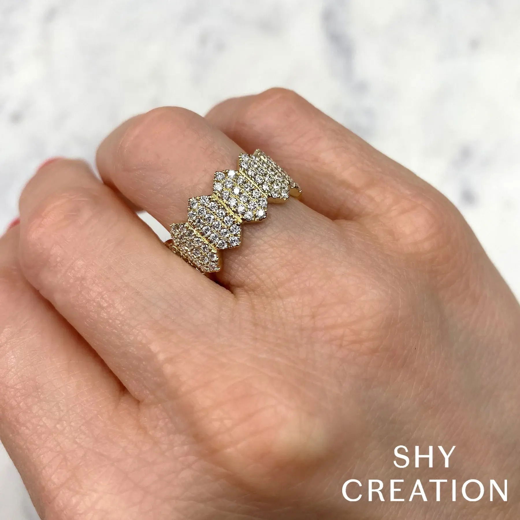 Bold and eye-catching, this piece is the perfect conversation starter for any event or gathering. All Shy Creation diamonds are natural and hand-selected. All stones are unique and hand set. As a result, you can expect slight variations in the shade, hue, tint of the color stones and stone count.-14k Yellow gold-Round diamonds, 1.04cts-Size 7Item# 804-2000040 Diamond Pave Hexagon Ring