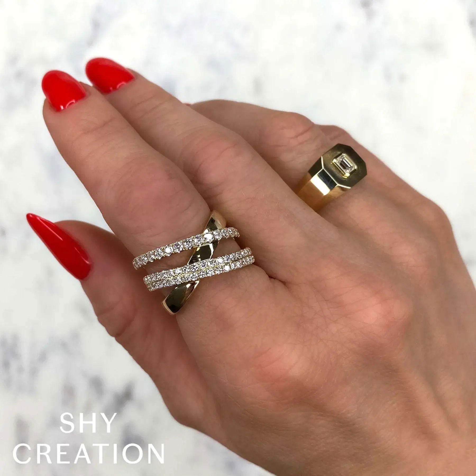 Perfect for special occasions, this piece combines bold style with timeless elegance to elevate your look. All Shy Creation diamonds are natural and hand-selected. All stones are unique and hand set. As a result, you can expect slight variations in the shade, hue, tint of the color stones and stone count.-14k Yellow gold-Round diamonds, 1.01cts-Size 7Item# 804-2000044 Diamond Bridge Ring