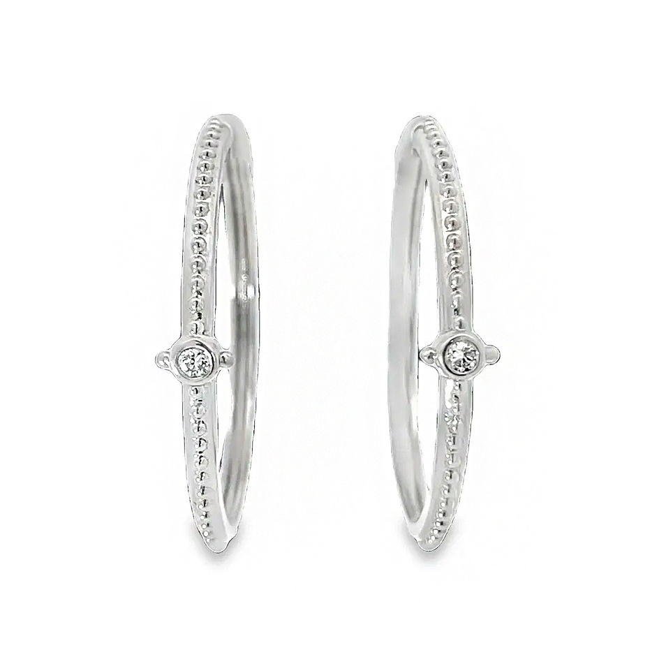 These 18k white gold earrings are decorated with sparkling round diamonds, offering a timeless and elegant design. Their refined style adds a touch of brilliance, making them perfect for both everyday wear and special occasions.-18k White gold-Round diamonds, 0.14ctsItem# 805-01419 White Gold Hoop Earrings