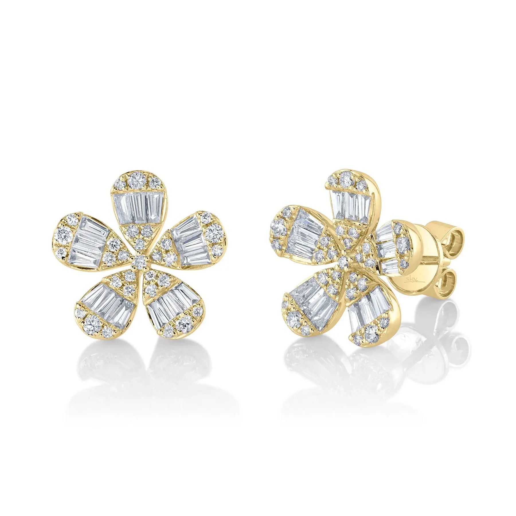 A beautiful accent piece or a stunning stand alone, this piece is the ideal addition to any collection. All Shy Creation diamonds are natural and hand-selected. All stones are unique and hand set. As a result, you can expect slight variations in the shade, hue, tint of the color stones and stone count.-14k Yellow gold-Round diamonds, 0.32cts-Baguette diamonds, 0.68cts-Dimensions, 0.55"L / 0.55"WItem# 805-01709 Diamond Baguette Flower Stud Earrings