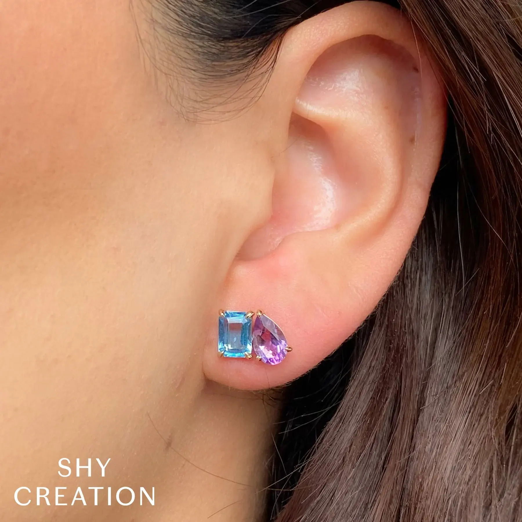 Make a lasting impression with this head-turning design, crafted for those who appreciate bold style. All Shy Creation diamonds are natural and hand-selected. All stones are unique and hand set. As a result, you can expect slight variations in the shade, hue, tint of the color stones and stone count.-14k Yellow gold-Emerald blue topaz, 2.08cts-Pear amethyst, 1.58cts-Dimensions, 0.45"L / 0.30"WItem# 805-01738 Amethyst & Blue Topaz Earrings