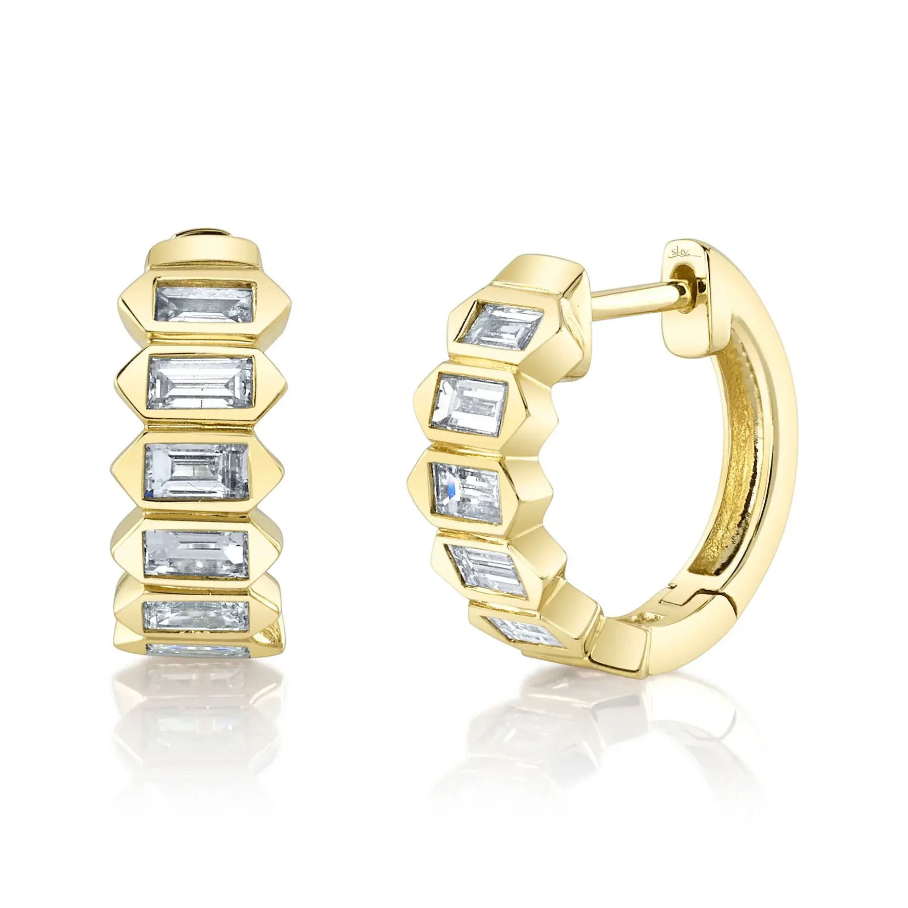 Catching the light with every movement, this piece adds a touch of elegance to any outfit. All Shy Creation diamonds are natural and hand-selected. All stones are unique and hand set. As a result, you can expect slight variations in the shade, hue, tint of the color stones and stone count.-14k Yellow gold-Baguette diamonds, 0.65cts-Dimensions, 0.50"L / 0.20"WItem# 805-01739 Diamond Baguette Huggie Earrings